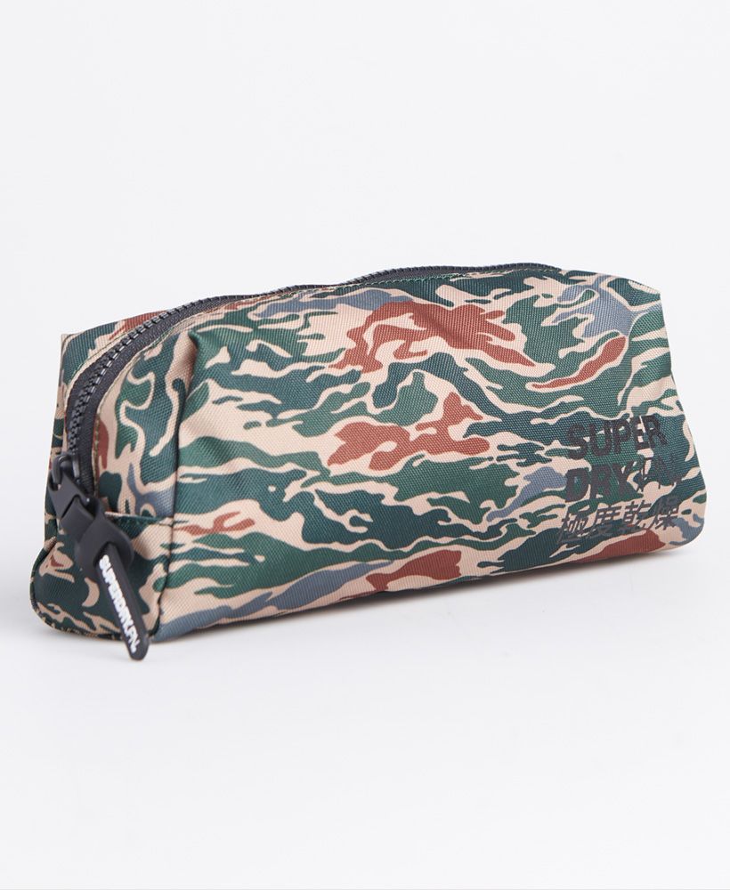 Superdry men's Classic pencil case. This classic pencil case features a zipped main compartment - plenty of room for storing all your stationery supplies. Completed with an iconic Superdry logo on the front and Superdry graphic on the zip pull.H 12cm x L 23cm x D 10cmAll over stripe print