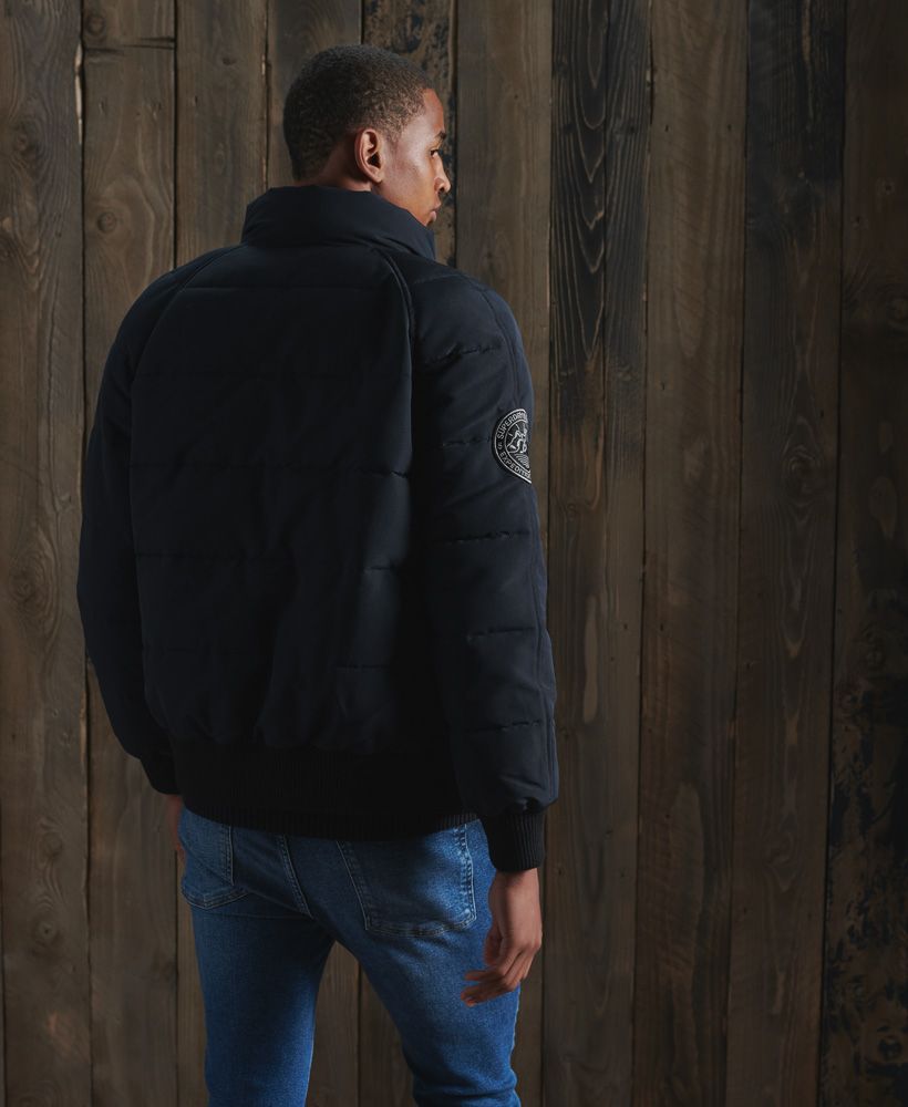 Everyone loves a versatile bomber, so we introduce to you the Everest Non Hooded Bomber Jacket, featuring a zip and popper fastening, ribbed cuffs and recycled polyester filling.Zip and popper fasteningRibbed cuffs and hemTwo front popper pocketsRecycled polyester paddingSignature logo patchThe padding in this jacket is 100% Recycled Polyester – each jacket contains up to 10 recycled bottles, this avoids these bottles being sent to landfill or polluting our oceans.