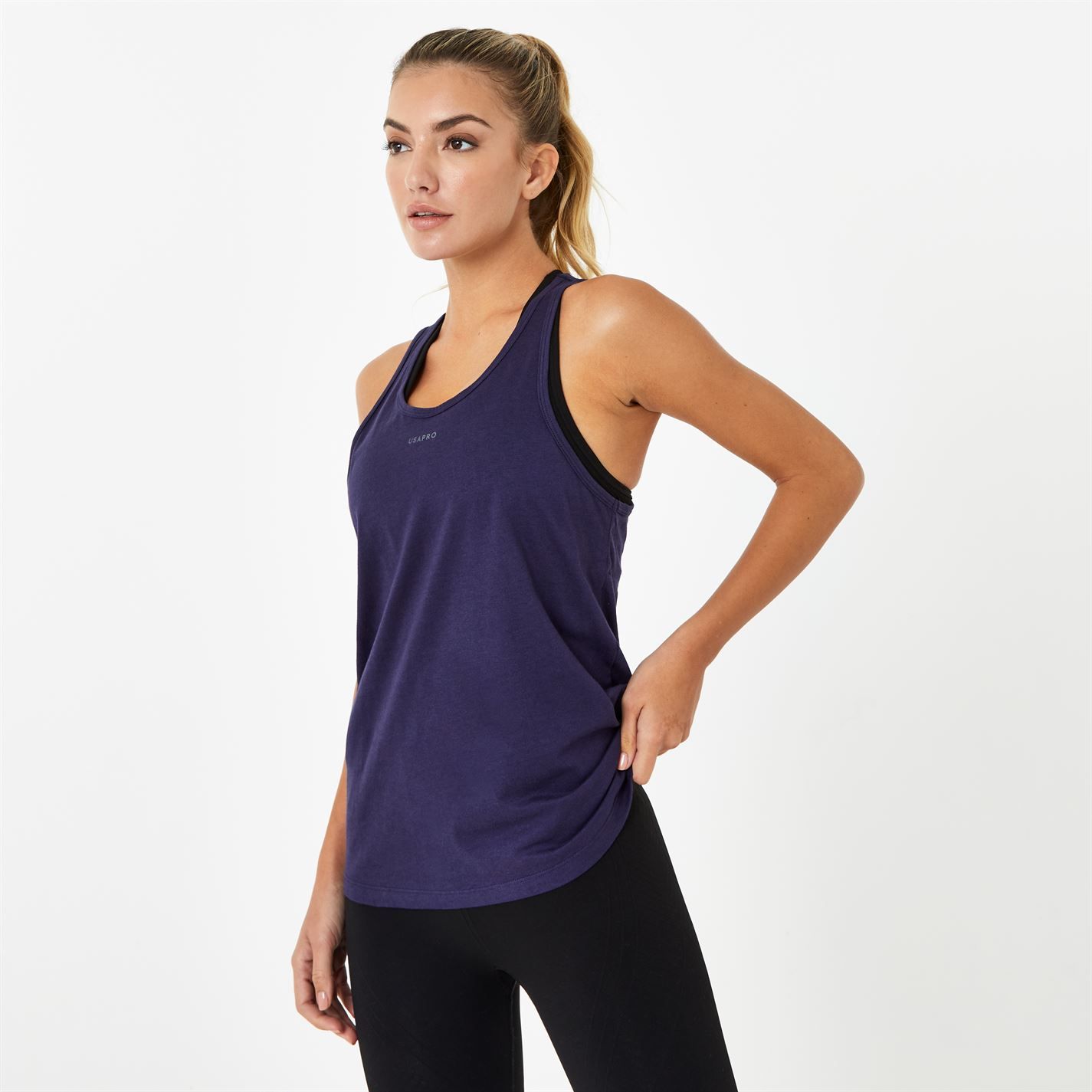 It’s all about investing in workout staples that will see you through any season. Opt for this classic sports tank in a flowy fit for the perfect addition to any sportswear collection. Made with crew neckline and racer back, this sleeveless design will be a game-changer in your next routine. Keep it casual with USA Pro with this lightweight design, creating optimal movement whilst the breathable fabric is constructed soft-touch material for a comfortable and stylish fit.  >Loose fit  >Crew neckline  >Racer back  >Pro-dry fabric  >Sleeveless  >Soft touch  >59% Cotton, 41% Modal  >Machine washable