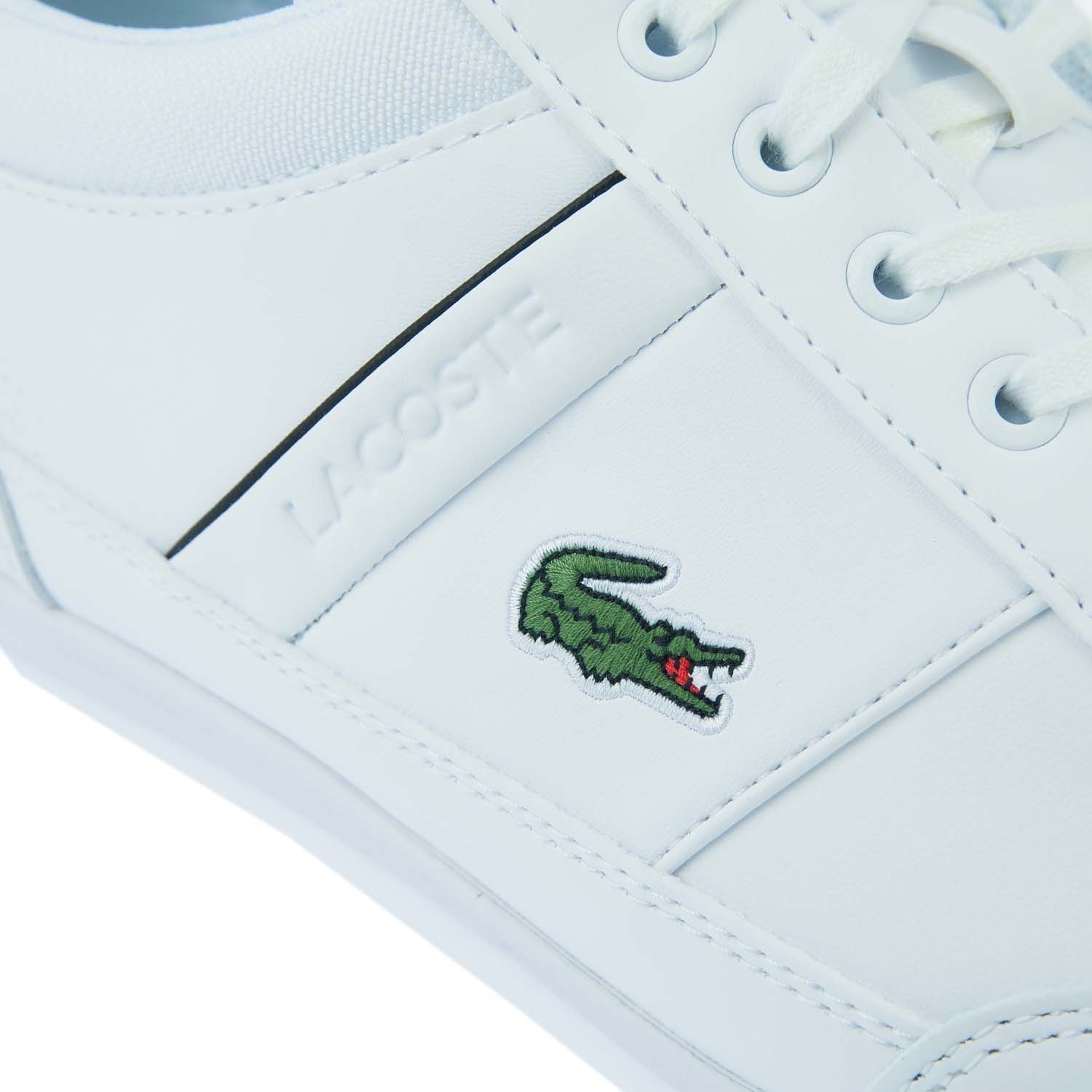Mens Lacoste Chaymon Trainers in white black.- Synthetic and leather uppers. - Lace up closure.- Embroidered green crocodile on the quarter. - Pared-back design in tonal shades for maximum versatility.- Rubber outsole.- Leather upper  Textile linings.- Ref: 742CMA0014147