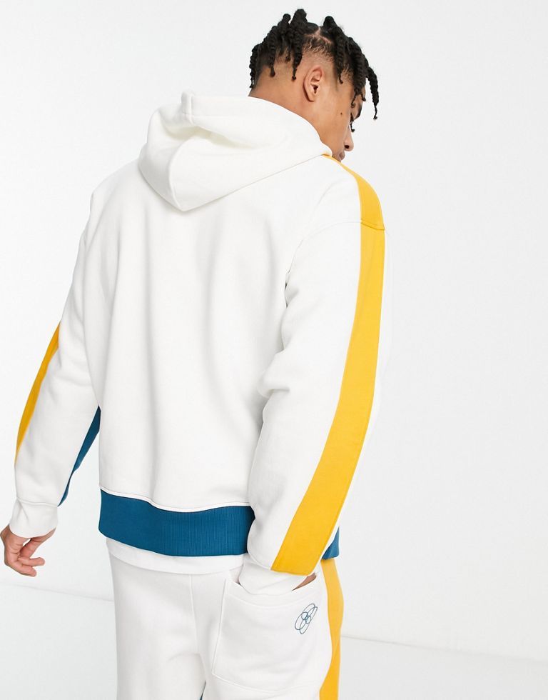 Hoodie by Topman Part of a co-ord set Joggers sold separately Colour-block design Drawstring hood Print to chest Pouch pocket Ribbed trims Relaxed fit Sold by Asos