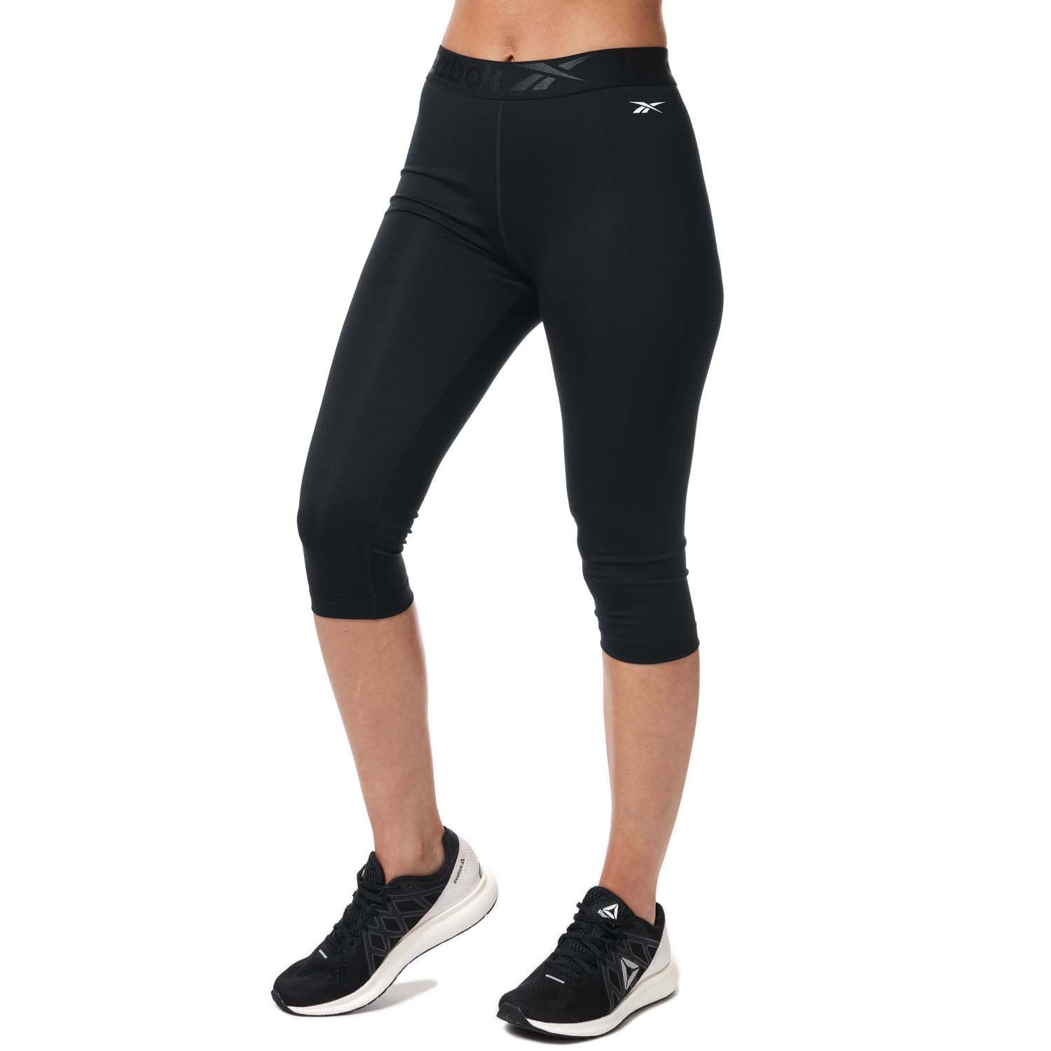 Womens Reebok Workout Ready Capri Tights in black.- Wide waistband and Reebok graphic.- Moisture-wicking fabric.- Reebok branding.- Fitted fit.- Main material: 91% Polyester  9% Elastane.  Machine washable. - Ref: FQ0405