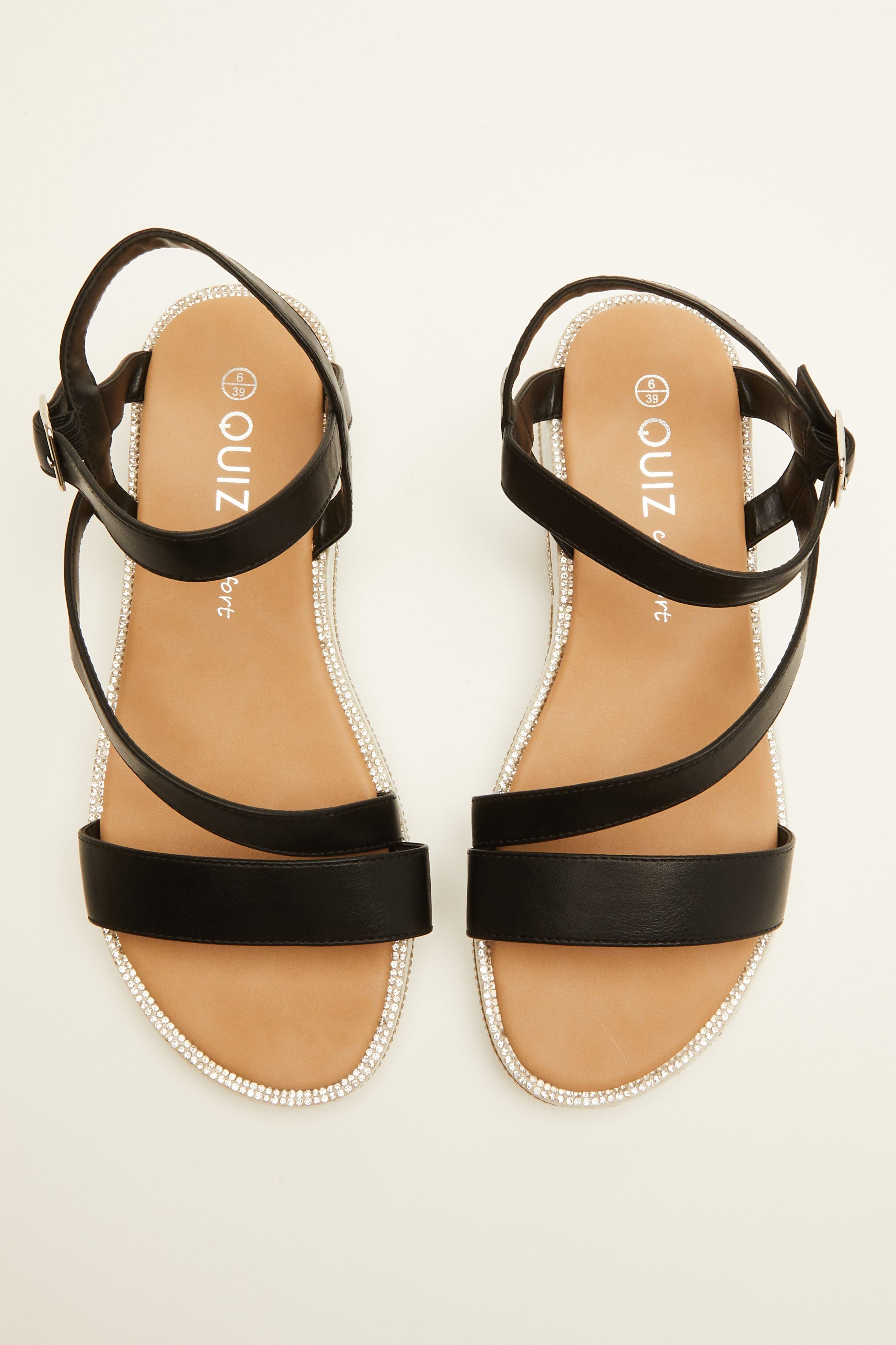 - Platform wedge  - Faux leather   - Asymmetric straps   - Embellished sole   - Heel height: 1.5