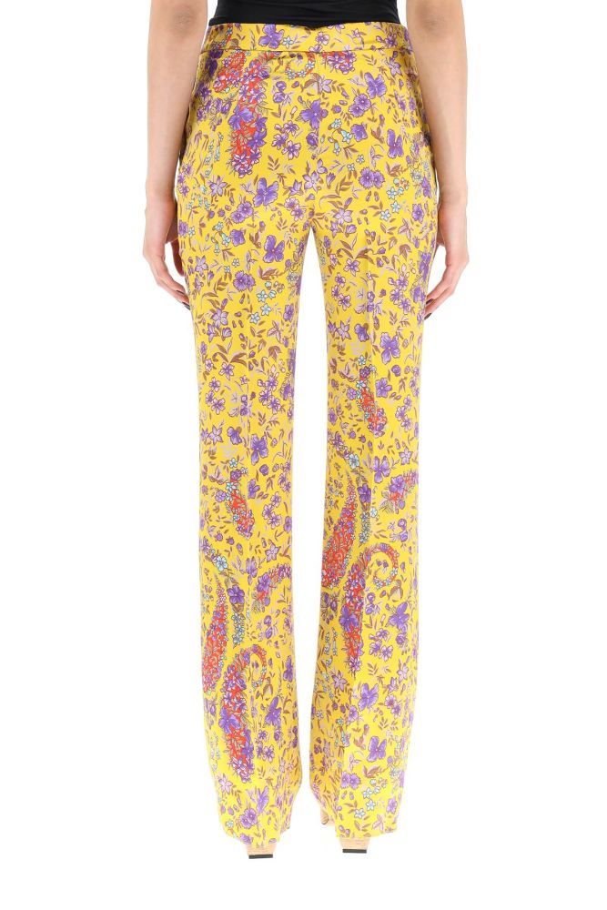 Etro tailored trousers in floral viscose envers satin. Regular fit with medium waist and slightly flared hem, side slash pockets, front concealed zip and hook closure. The model is 177 cm tall and wears a size IT 40.