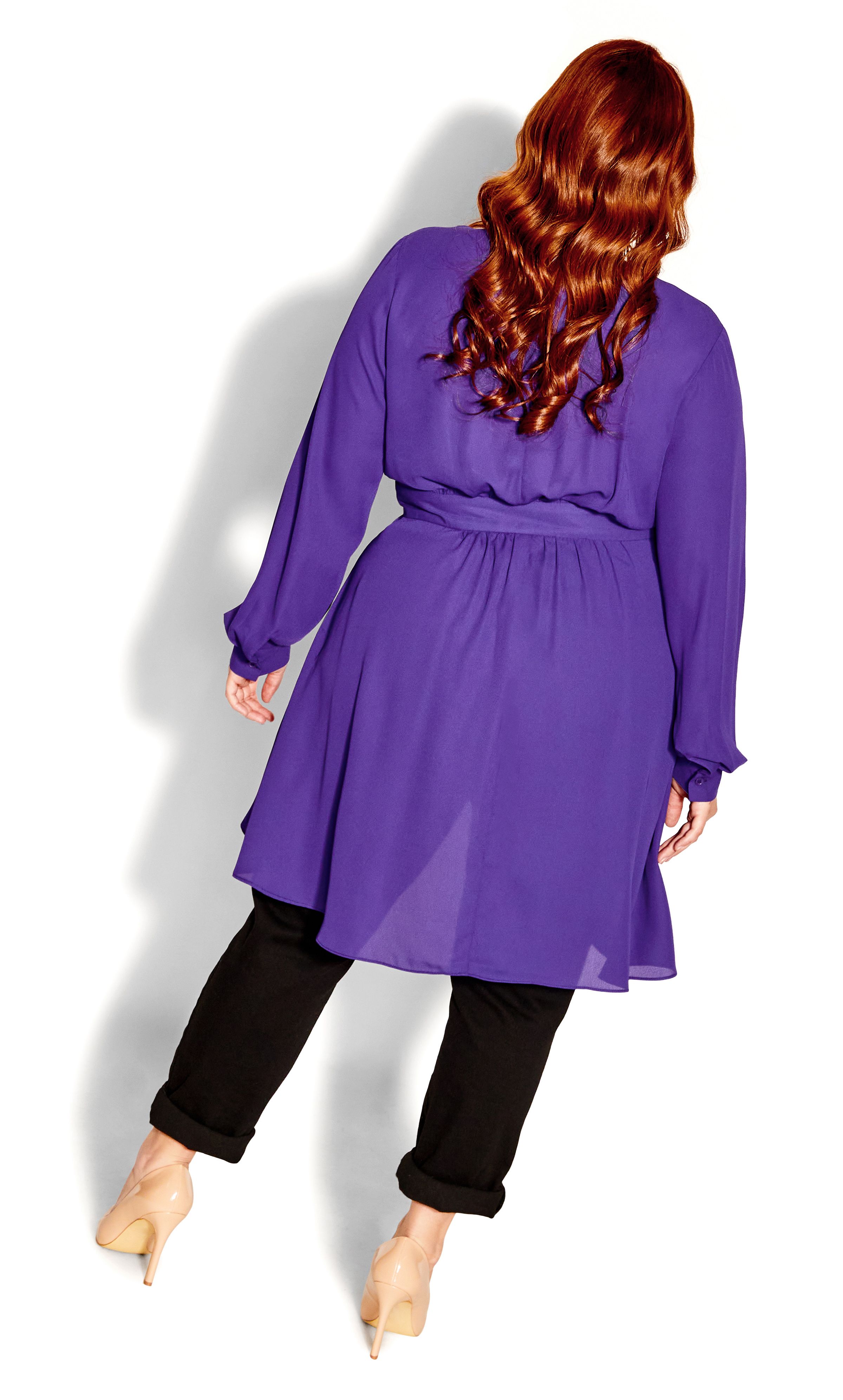 Turn up the drama in the fabulous staple CC style, the Shibara Top. Now in an enchanting purple hue, this classic draped top is designed to fit and flatter your curves to absolute perfection! Key Features Include: - Deep V-neckline - Long sleeves with button cuff - Single button & loop centre front fastening - Self-tie waist detail - Centre front drape feature - Hi-lo hemline Rock this show-stopping top with glamourous statement jewellery and a mule heel for an elegant touch.