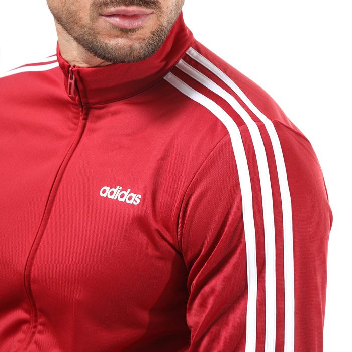 Mens adidas Essentials 3- Stripes Tricot Track Top in red.- Stand-up collar.- Long sleeves with ribbed cuffs.- Full zip fastening.- Side welt pockets.- Ribbed hem.- Applied 3-Stripes at sleeves.- Regular fit.- Main material: 100% Polyester (Recycled) . Machine washable. - Ref: EI4891