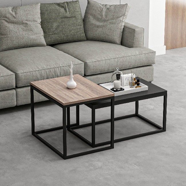 This stylish and functional coffee table is the perfect solution for furnishing the living area and keeping magazines and small items tidy. Easy-to-clean, easy-to-assemble kit included. Color: Walnut, Black | Product Dimensions: High Coffee Table W60xD47xH45 cm, Low Coffee Table W72xD45xH37 cm | Material: Melamine Chipboard, Metal | Product Weight: 12,5 Kg | Supported Weight: Each Coffee Table 10 Kg | Packaging Weight: W79xD51xH13,2 cm Kg | Number of Boxes: 1 | Packaging Dimensions: W79xD51xH13,2 cm.