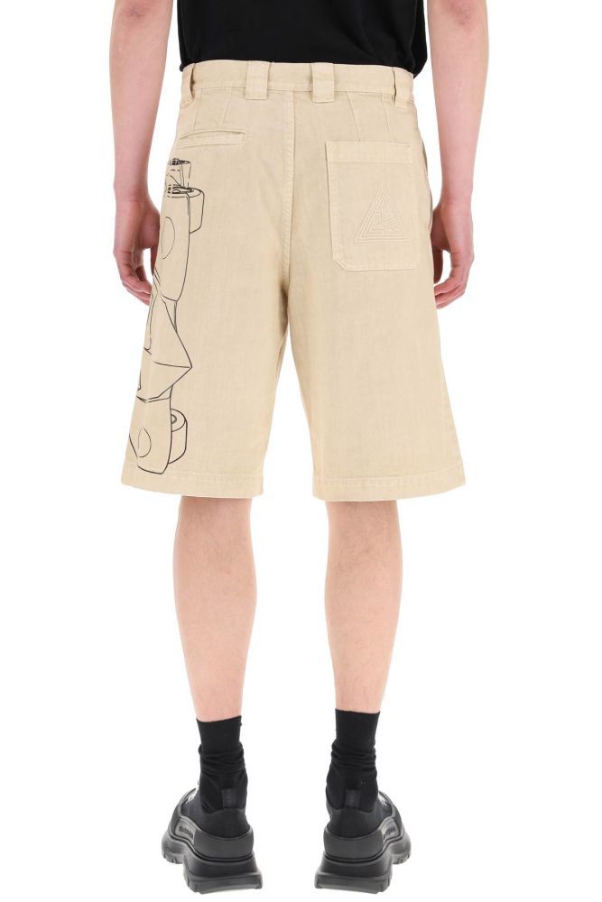 Lanvin bermuda shorts in cotton denim, enriched by side Batman print. Concealed button closure, slash pockets and tonal triangular logo embroidery on the rear patch pocket. Welt pocket at back. Relaxed fit. The model is 187 cm tall and wears a size 31.