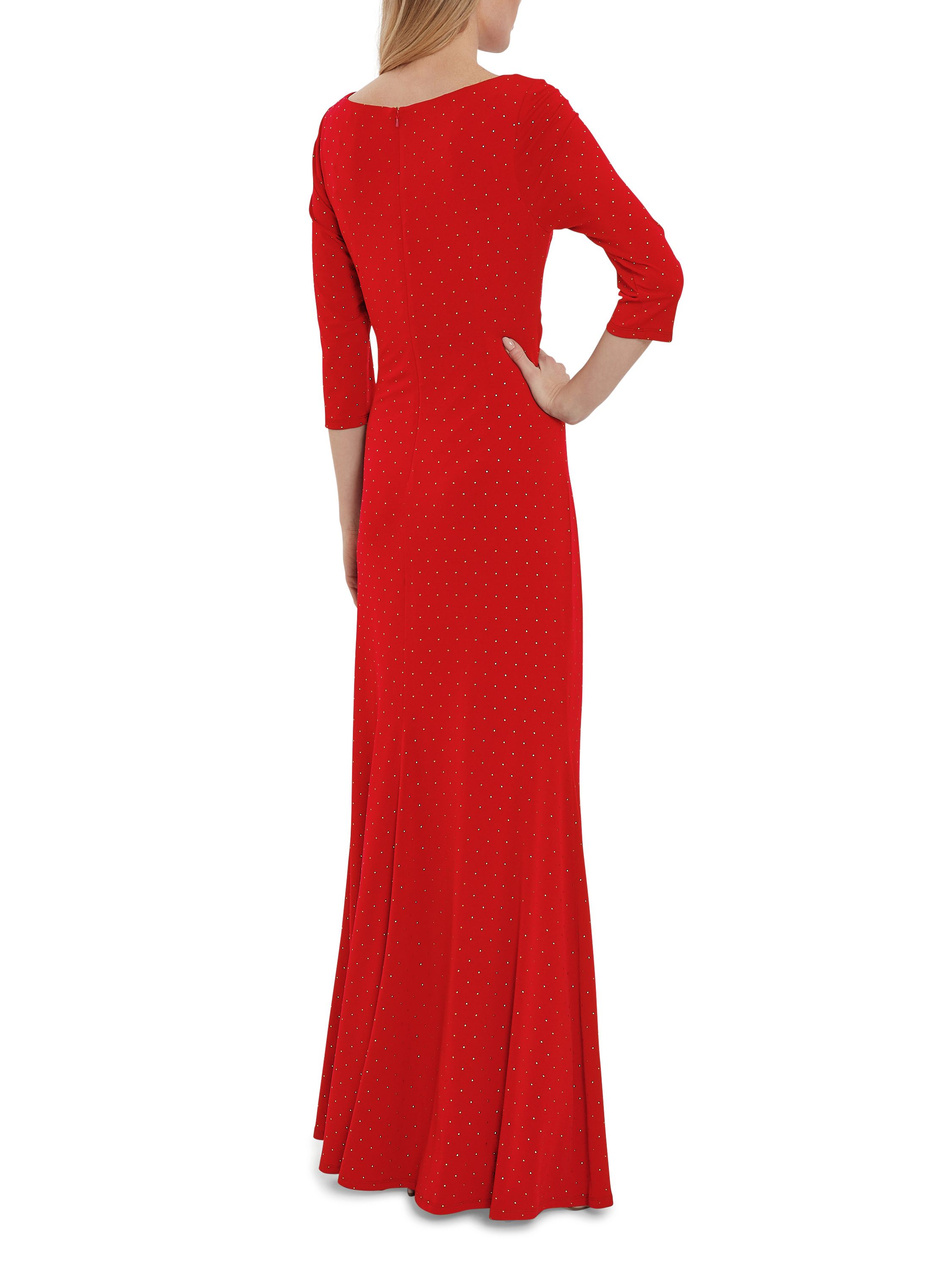 This maxi dress by Gina Bacconi is a showstopper of a piece. This piece is fashioned from a luxuriously soft jersey fabric with stud detailing which gracefully wraps over the bodice and ruches at the side of the waist. The asymmetric drape of the dress offers you a flawless silhouette. This dress is fully lined for extra comfort and fastens using a concealed centre back zip.