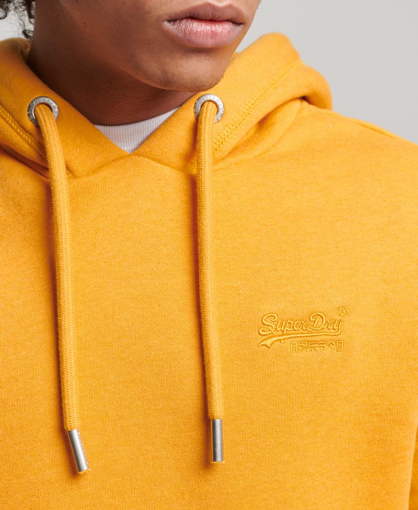 The rustic aesthetic of Americana is deeply tied into our vintage range, as we draw inspiration from the workers who built that culture. Practical, comfortable, and high quality - these are the marks we ensure to hit with every single design, right down to our most classic and simple. This hoodie is a lovingly crafted product of that, and we've put our signature touch on it to ensure that you'll be a part of the Superdry family.Slim fit – designed to fit closer to the body for a more tailored lookOrganic cottonDrawcord-adjustable hoodLong sleevesRibbed trimsFront pouch pocketEmbroidered Superdry logoMade with organic cotton grown using natural rather than chemical pesticides and fertilisers. The healthier soil this creates uses up to 80% less water which is better for our planet and for the farmers who grow it.