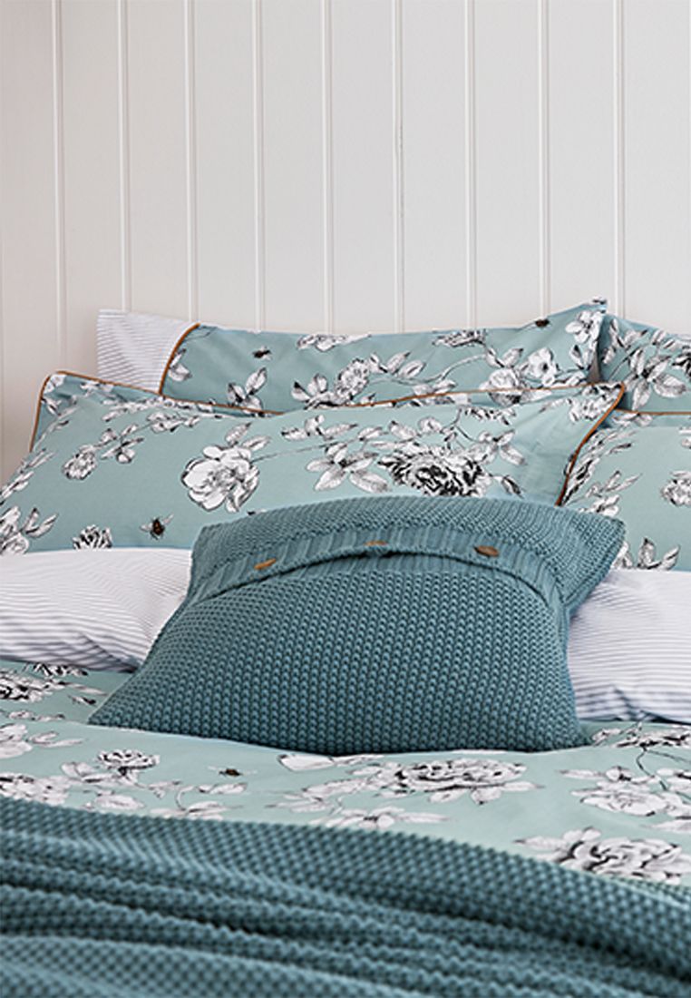 Make diving into bed even more of a treat with this floral duvet set. Featuring an all over hand-drawn print (complete with appearances from some colourful bees) against a plain blue background, it will add a classic look to any bedroom. Flip it over and you'll find a horizontal stripe design that complements the set perfectly. Each set comes complete with two matching Oxford pillowcases (single sets come with one) and has a thread count of 180 for much-needed cosiness. BCI Cotton, Made in Pakistan.