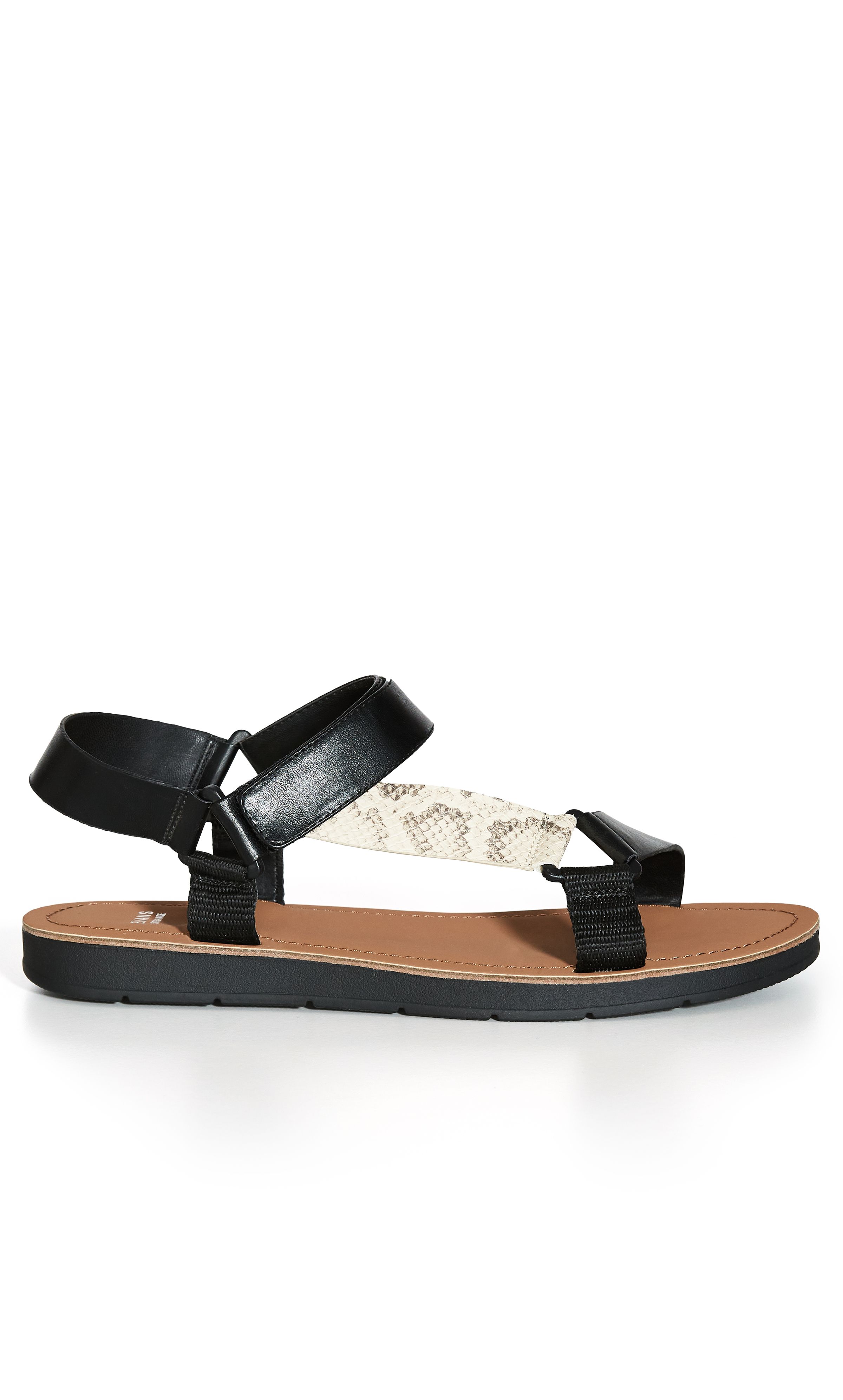 Keep on-trend this summer in the chunky stylings of our Snake Sporty Strap Sandal! Featuring an easy velcro closure and extra wide fit, these shoes are a seamless balance of comfort and style. Key Features Include: - Round open toe - Thick strapping - Velcro closure - Thick cushioned sole Upstyle with a flirty wrap dress and cute underarm bag.