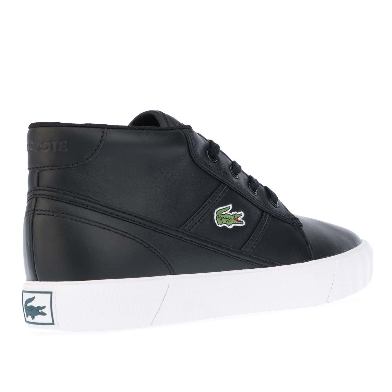 Mens Lacoste Gripshot Chukka Trainers in Black- Canvas and leather uppers.- Lace up fastening with comfortable flat laces.- Comfortable textile lining.- Ortholite sockliner for comfort and odour control.- Embroidered Lacoste lettered branding at tongue.- Contrast heel patch with debossed Lacoste lettered branding.- Embossed crocodile at back heel.- Embroidered crocodile to side.- Rubber sole.- Ref: 742CMA0035312