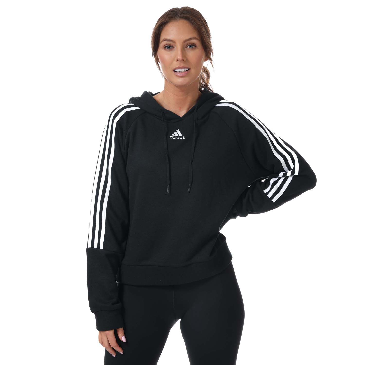 Womens adidas Essentials 3- Stripes Cropped Hoody in black.- Drawcord-adjustable hood.- Long sleeves.- Ribbed cuffs.- 3-Stripes down both arms.- adidas Badge of Sport logo on the chest.- Relaxed fit.- Main Material: 53% Cotton  36% Polyester (Recycled)  11% Rayon. Hood Lining: 100% Cotton. - Ref:GL1460