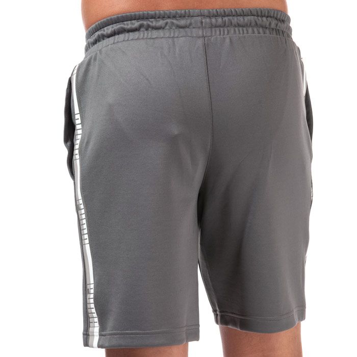 Puma Mens Poly Tape Shorts in grey.<BR><BR>- Puma logo to the left leg.<BR>- Drawcord and elasticated waist.<BR>- Two side pockets.<BR>- Printed Puma branding running down both legs.<BR>- 65% Polyester  35% Cotton. Machine washable.<BR>- REF: 58571002