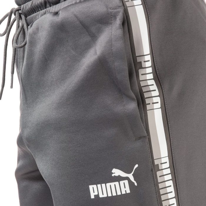 Puma Mens Poly Tape Shorts in grey.<BR><BR>- Puma logo to the left leg.<BR>- Drawcord and elasticated waist.<BR>- Two side pockets.<BR>- Printed Puma branding running down both legs.<BR>- 65% Polyester  35% Cotton. Machine washable.<BR>- REF: 58571002
