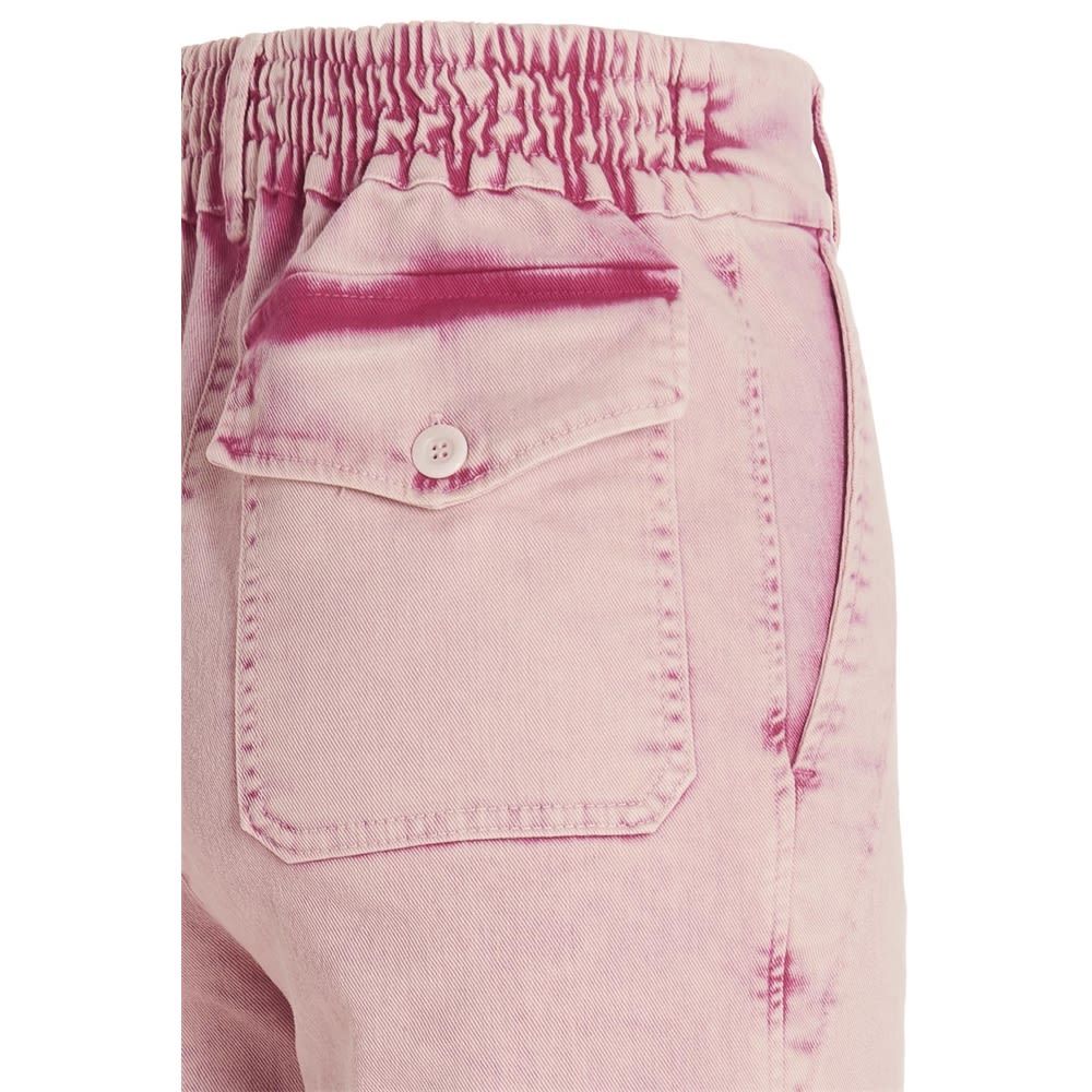 Délavé-effect cotton trousers with a zip and button fastening, pockets and an elasticized insert at the waist.