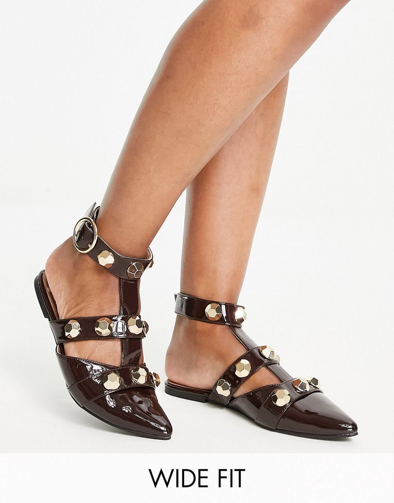 Shoes by ASOS DESIGN Love at first scroll Studded design Adjustable ankle strap Pin-buckle fastening Pointed toe Flat sole Wide fit Sold by Asos