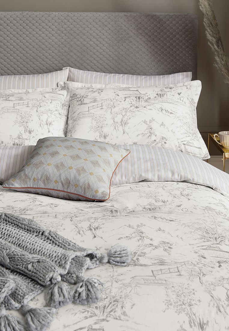 A classic toile style pattern with romantic scene and foliage design in light grey on an ivory base. The design reverses to a vertical stripe, all made from 100% BCI cotton ensuring the cotton we use is better for the environment and for those who produce it. Includes Pillowcase(s). Machine Washable. Made in Pakistan.