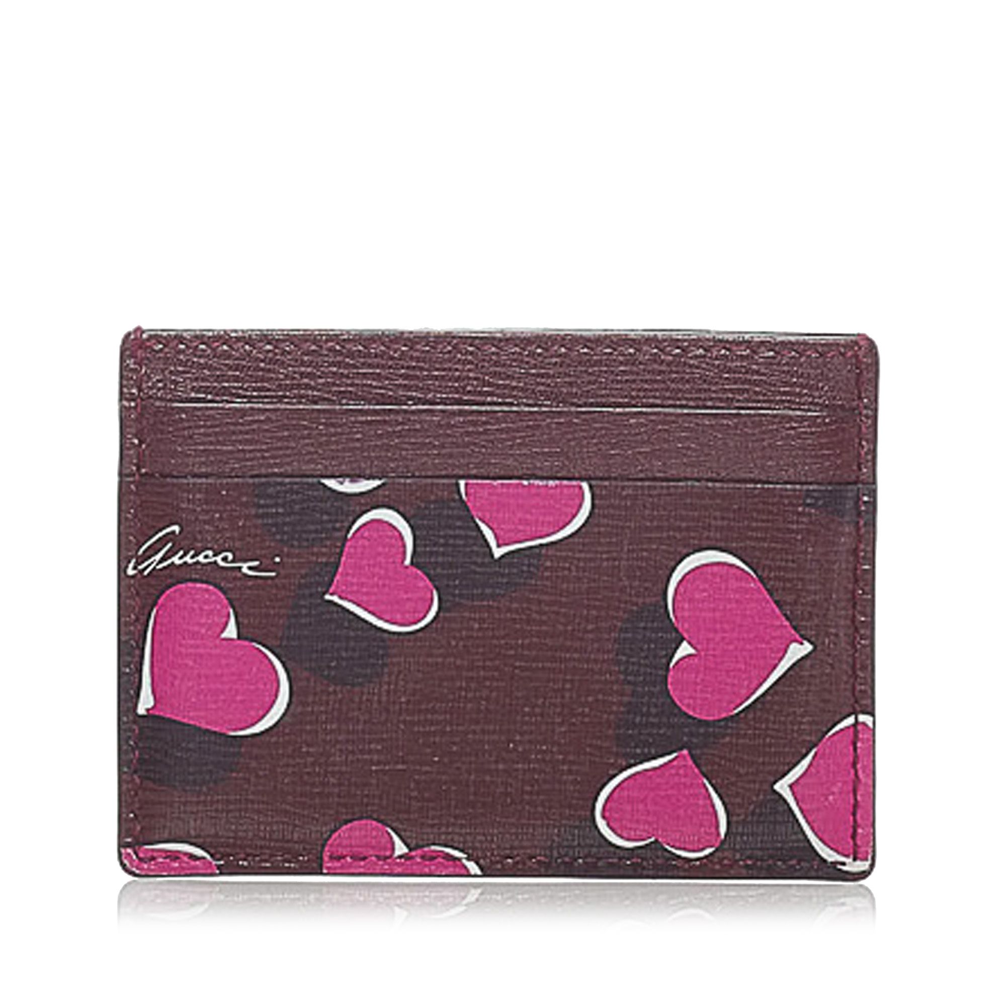 VINTAGE. RRP AS NEW. This card holder features a leather body with heart print and slip pockets.Exterior front is out of shape and stained with others. Interior pocket is stained with others.

Dimensions:
Length 7cm
Width 9.5cm

Original Accessories: This item has no other original accessories.

Serial Number: 334483
Color: Red x Bordeaux x Multi
Material: Leather x Calf
Country of Origin: Italy
Boutique Reference: SSU160330K1342


Product Rating: GoodCondition

Certificate of Authenticity is available upon request with no extra fee required. Please contact our customer service team.