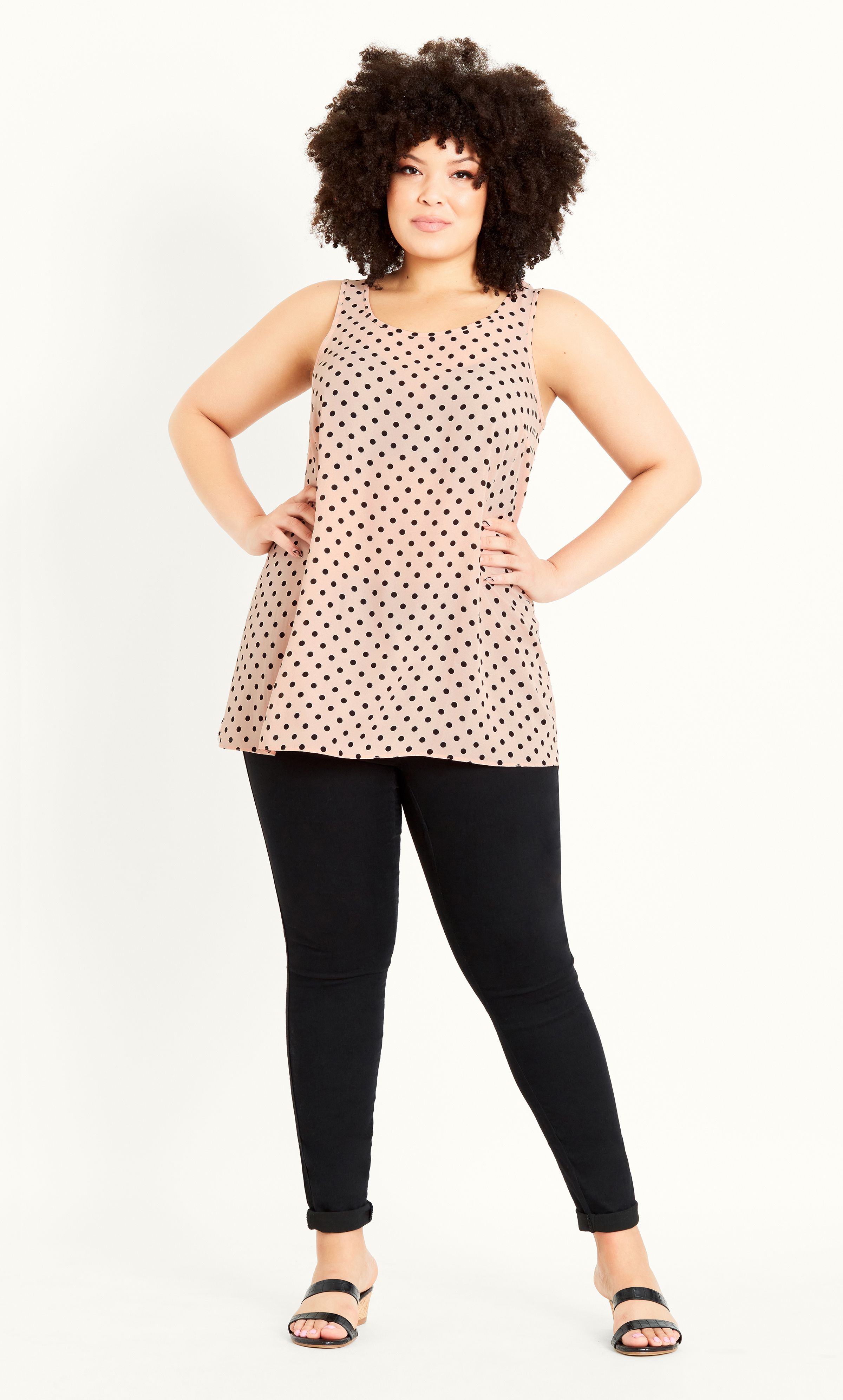 Super cute and effortless, the Spot Print Vest is a playful addition to your summer collection. With a blush pink hue and slightly flared silhouette, this top will drape over your curves effortlessly, keeping you breezy and stylish at the same time! Key Features Include: - Scoop neckline - Sleeveless - Lightweight non-stretch fabrication - Slightly flared silhouette - Unlined - Relaxed fit - Pull over style - Hip length Wear with frayed mini shorts, wedges and a pair of gold hoops for upstyled Saturday styling!