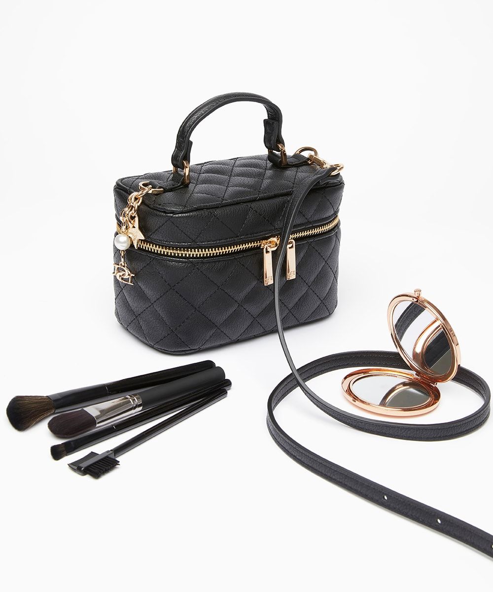 The stylish way to pack all your beauty essentials. Made from chic quilted faux-leather the gold zip opens up to reveal the central compartment and an internal mirror. The decorative gold inital logo, star and pearl charms add to the elegant look. Fe