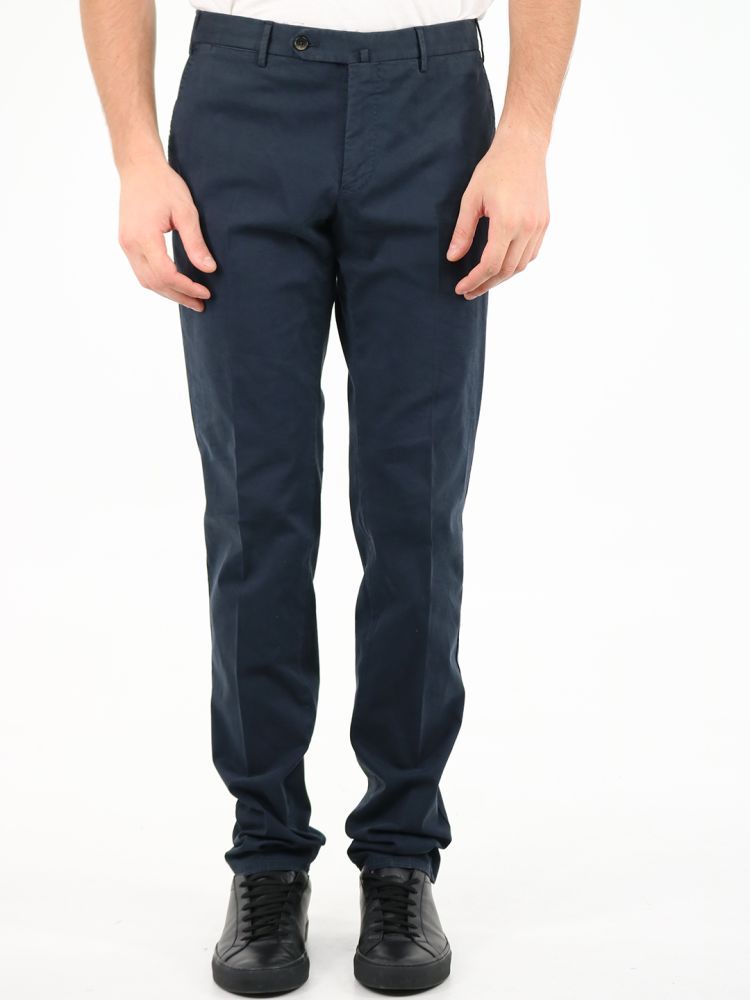 Superslim blue trousers made of cotton. They feature front zip and button closure, belt loops, two side pockets and two back buttoned pockets.The model is 184 cm tall and wears a size 48
