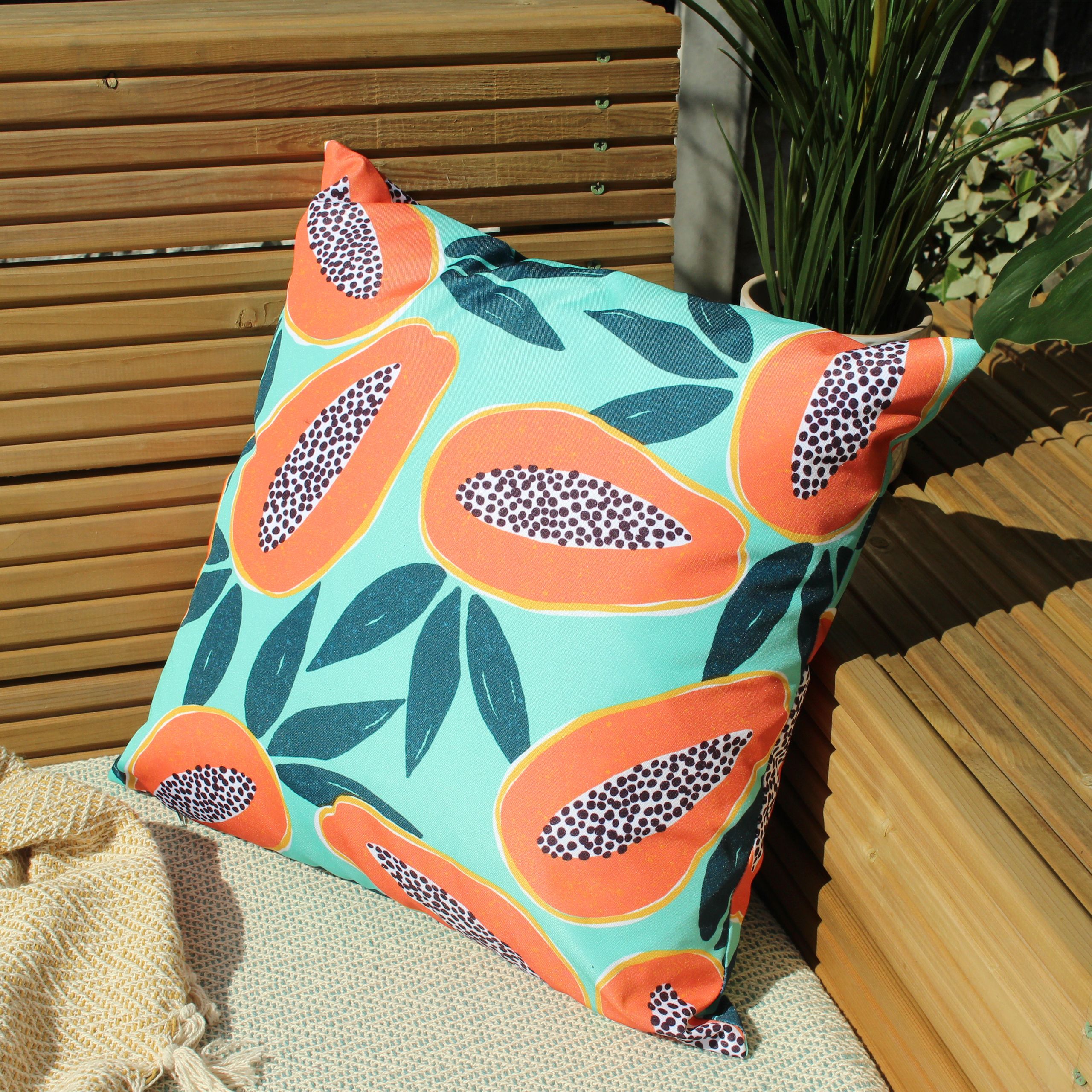 Amongst the green leaves, features a vibrant Papaya fruit print in bold oranges and tropical greens. Pop it in your outdoor space, it is sure to stand out.