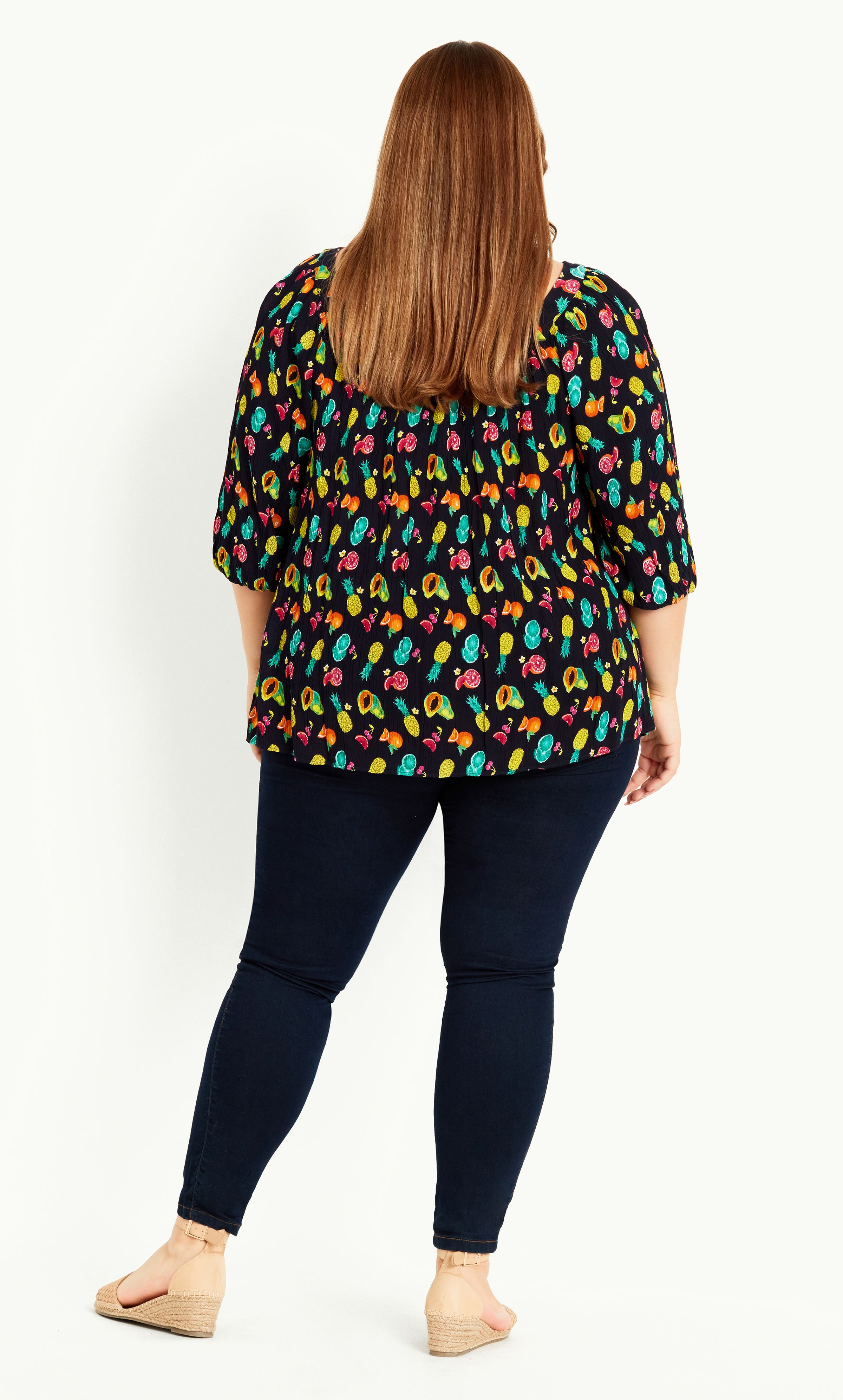 A little bit playful and all kinds of stylish, the Fruit Button Through Top brings a youthful touch to any wardrobe. Featuring a square neckline, lightweight fabrication and fun-loving fruit print for major summer vibes, this breezy blouse ticks all the boxes! Key Features Include: - Square neckline - 3/4 sleeves - Textured non-stretch fabrication - Relaxed fit - Pull over style - Unlined - Hip length Team with skinny jeans, espadrilles and a bold lip for an upstyled Saturday outfit.