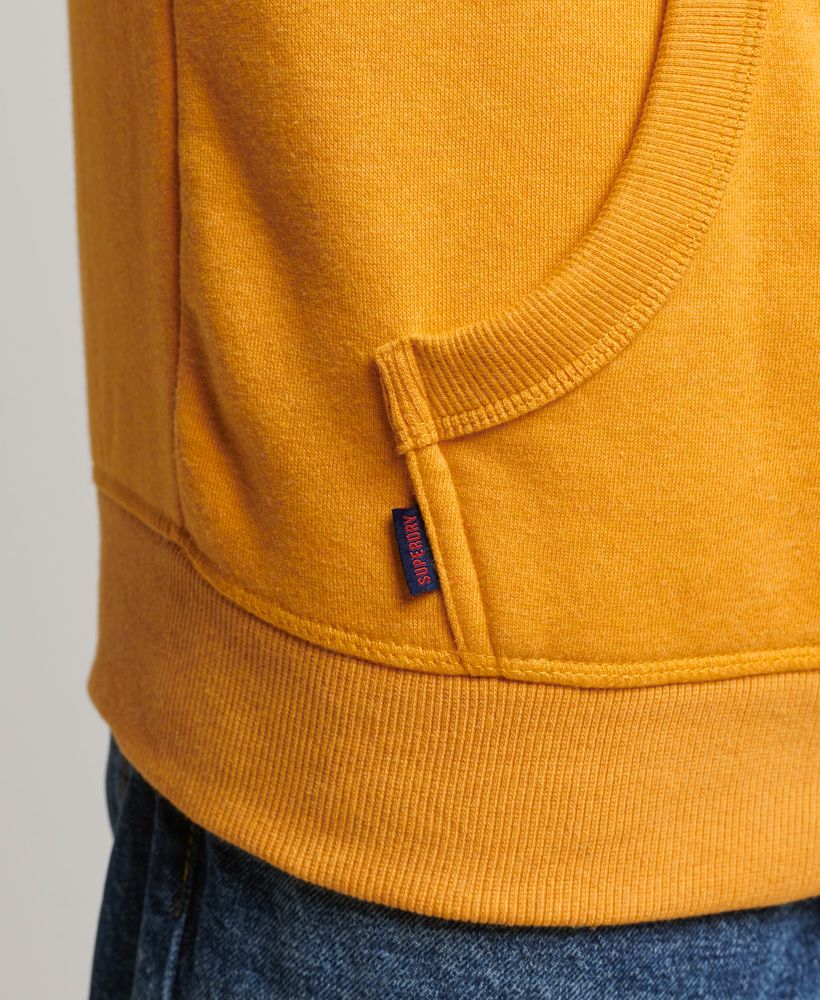 The rustic aesthetic of Americana is deeply tied into our vintage range, as we draw inspiration from the workers who built that culture. Practical, comfortable, and high quality - these are the marks we ensure to hit with every single design, right down to our most classic and simple. This hoodie is a lovingly crafted product of that, and we've put our signature touch on it to ensure that you'll be a part of the Superdry family.Slim fit – designed to fit closer to the body for a more tailored lookOrganic cottonDrawcord-adjustable hoodLong sleevesRibbed trimsFront pouch pocketEmbroidered Superdry logoMade with organic cotton grown using natural rather than chemical pesticides and fertilisers. The healthier soil this creates uses up to 80% less water which is better for our planet and for the farmers who grow it.