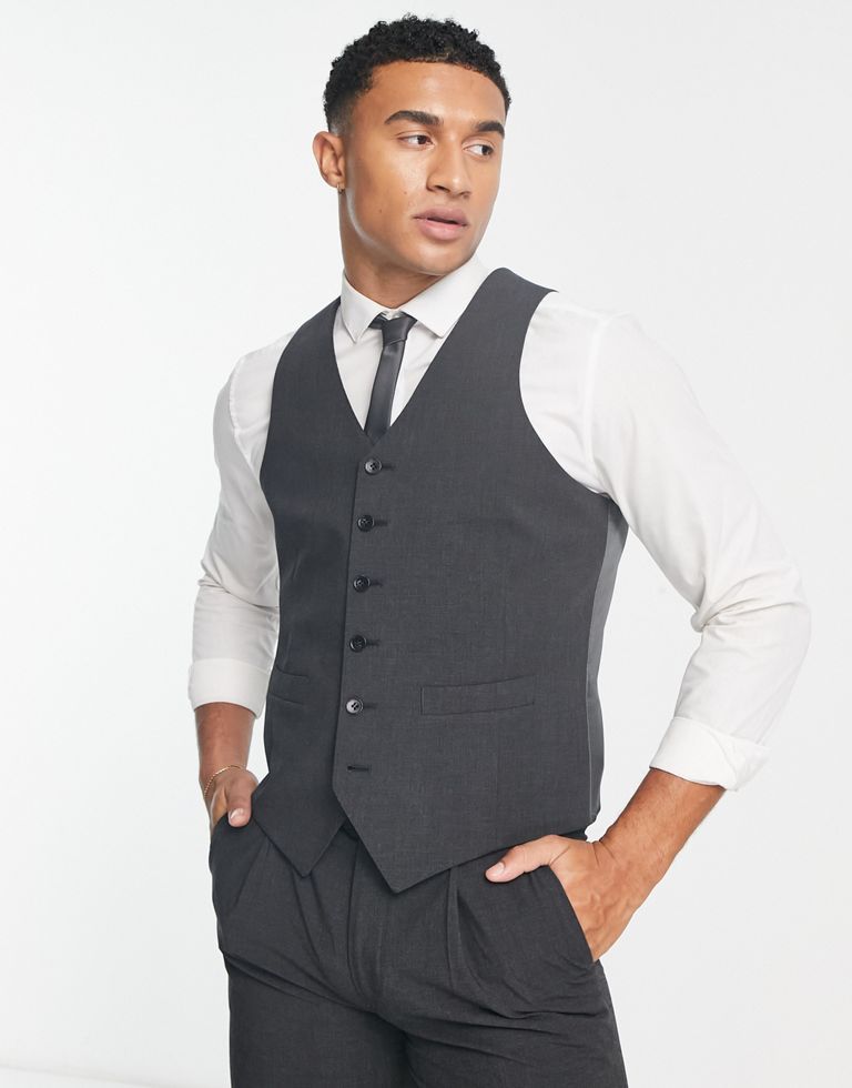 Suits by Noak For office, or out of office V-neck Button placket Contrast back with an adjustable cinch Slim fit Sold by Asos