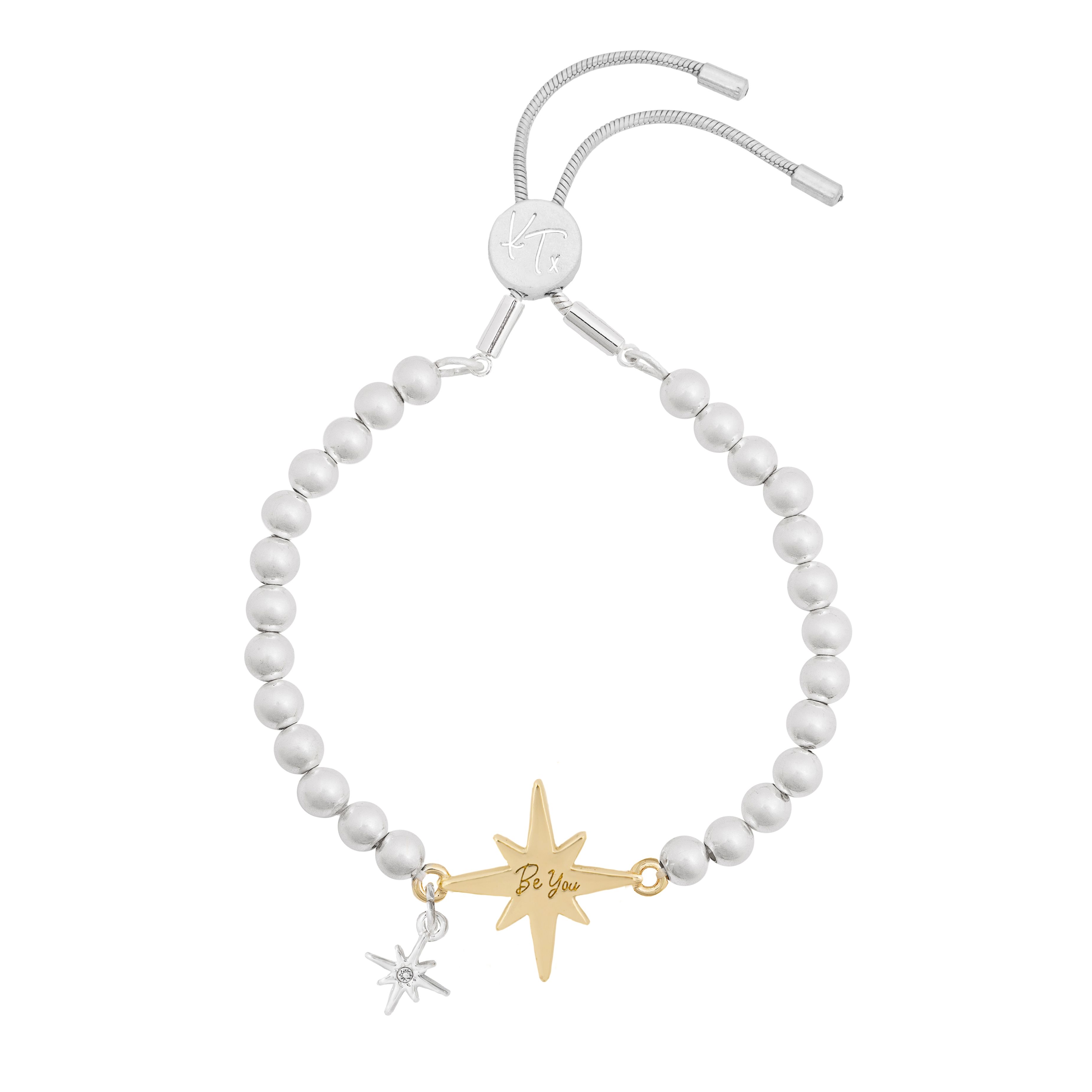 This easy-to-wear silver bracelet features a sparkly gold star charm – the North Star, a symbol of hope and inspiration, helping to guide you on your way through life. On the reverse, the affirmation ‘Be You’ is engraved, making it the perfect gift for friends – or for yourself! It features a sliding clasp, so is easily adjusted, whatever the size of your wrist. Wear alone or as part of a bracelet stack with our other KTxBibi bracelets for a real style statement.