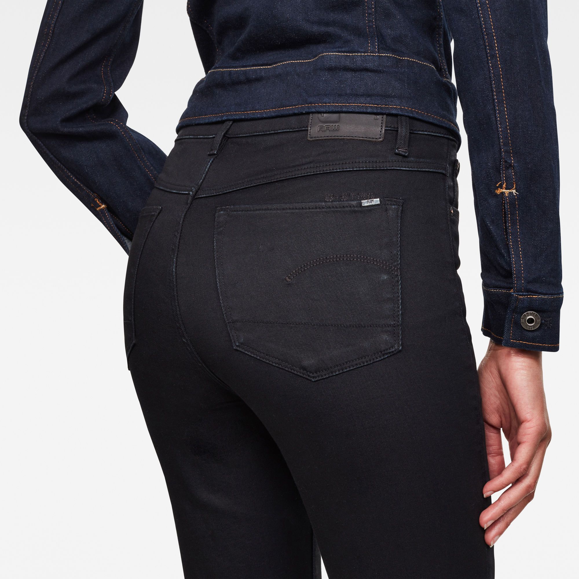 Fitted waistband. High waist. Tight through the thigh, flared leg towards hem. Brand graphic set just above the back pocket. Zip fly. Zip & button closure. High waist. This superstretch denim is created out of a technical and sustainable multi-fiber blend. Designed with high stretch and recovery and a soft handfeel. 9.75 oz stretch denim, 3x1 Right hand twill construction. 35% Cotton, 35% Tencel™ Lyocell, 28% Polyester (Recycled), 2% Elastane (Lycra®). Skinny Flare