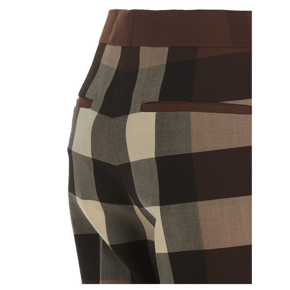 Aimie' pants featuring a check print and a zip, hook-and-eye and button closure.