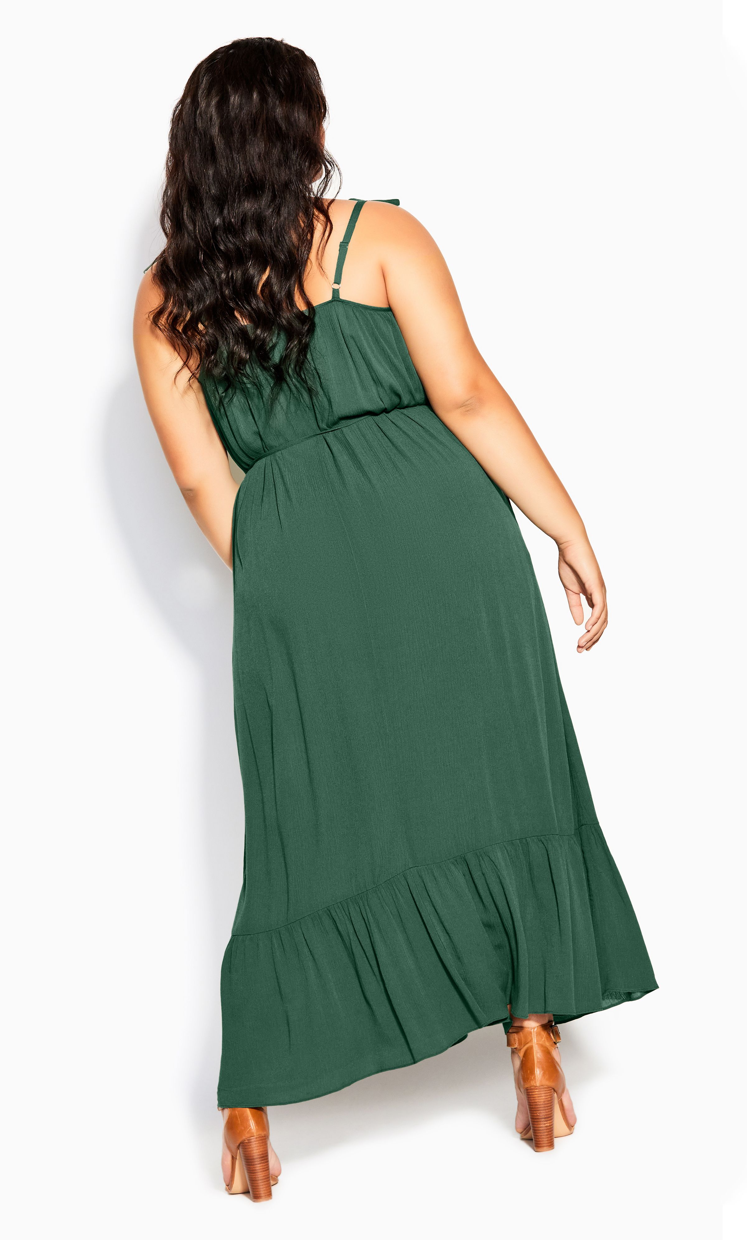 Swish and sway with elegance in the flirty Tropical Escape Maxi Dress. Doused in a flattering jungle green, with thin tied straps and a fabulously frilled hem, this floaty maxi dress is a summer must-have! Key Features Include: - Rounded neckline - Thin adjustable straps with tie feature - Removable self-tie string waist belt with tassel finishes - Pull over style - Unlined - Relaxed fit - Frilled maxi length hemline For casual weekend strolls to the shops, dress this look down with simple slides. Doll it up for sunset cocktails by adding a pair of strappy block heels.