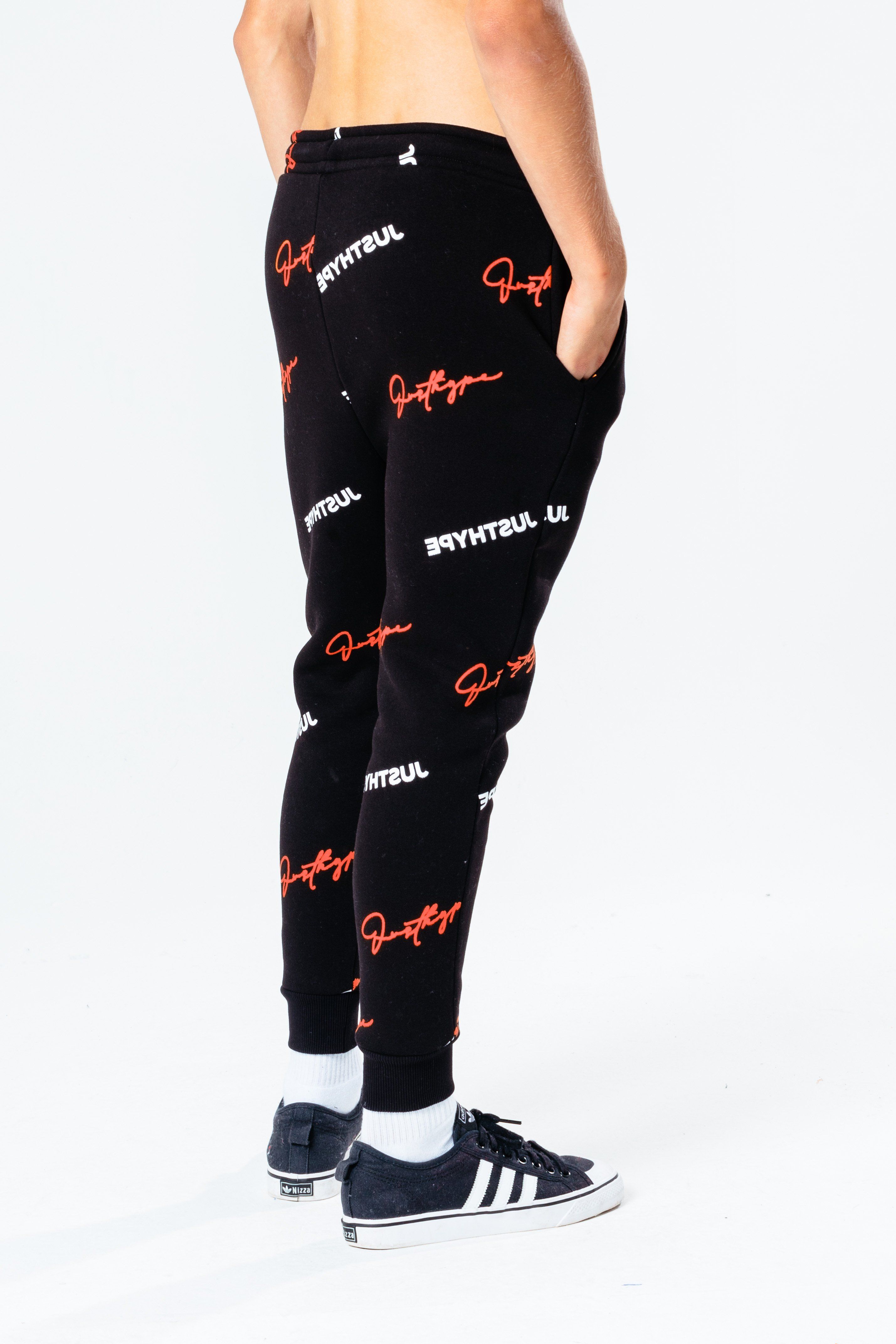 Perfect to add to your everyday jogger rotation. The HYPE. black repeat logo kids joggers feature a monochrome colour palette with a red injection. Designed in a soft-touch fabric for the ultimate comfort in our standard unisex kids jogger shape. Finished with an elasticated waistband, fitted cuffs and the iconic HYPE. script logo in a contrasting cyan. Wear with the matching hoodie to complete the look. Machine wash at 30 degrees.