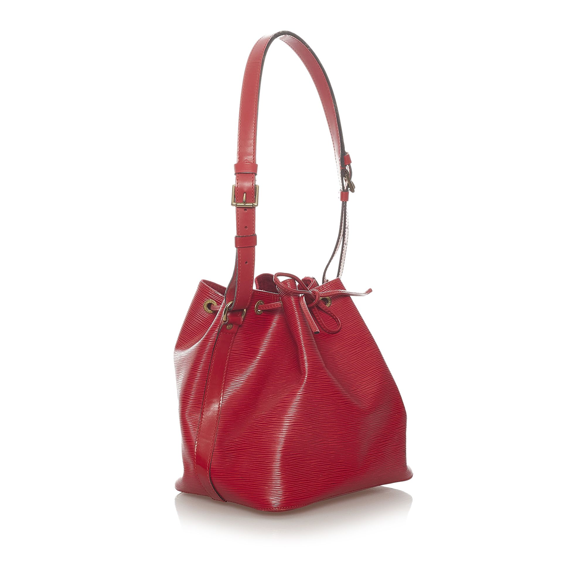 VINTAGE. RRP AS NEW. The Petit Noe features an epi leather body, an adjustable shoulder strap, a drawstring closure, Alcantara lining, and an interior zip pocket.Exterior back is scratched and stained. Exterior bottom is scratched. Exterior corners is scratched. Exterior front is scratched and stained. Exterior handle is scratched. Exterior side is stained. Buckle is tarnished. Screw is tarnished. Interior lining is scratched and stained.

Dimensions:
Length 25cm
Width 23cm
Depth 17.5cm
Shoulder Drop 23cm

Original Accessories: Dust Bag

Serial Number: AR 0916
Color: Red
Material: Leather x Epi Leather
Country of Origin: FRANCE
Boutique Reference: SSU173410K1342


Product Rating: GoodCondition

Certificate of Authenticity is available upon request with no extra fee required. Please contact our customer service team.