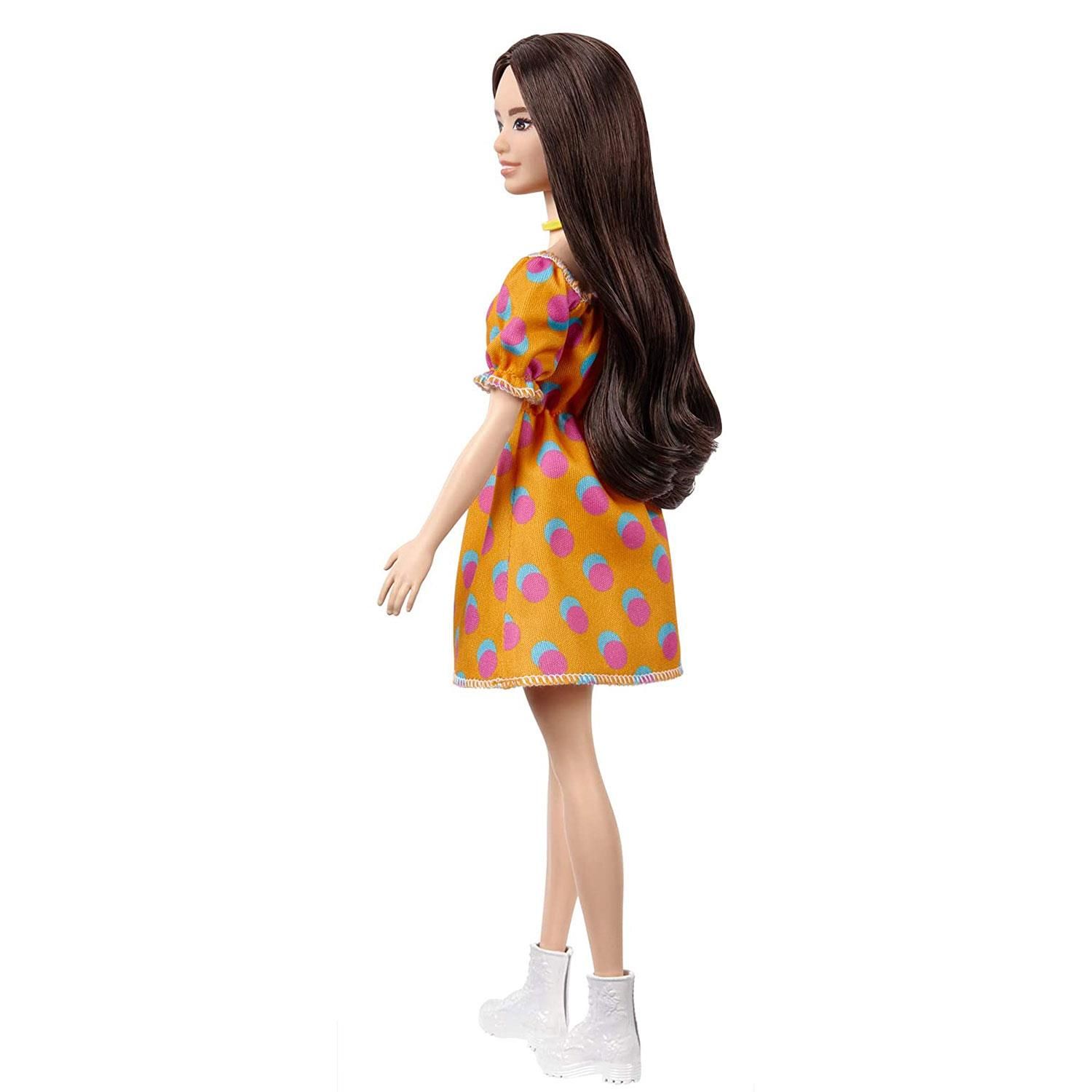 Barbie Fashionista Doll with Orange Fruit Dress, Great Toy For 3 Years Old & Up

Barbie and Ken Fashionistas celebrate diversity with fashion dolls that encourage real-world storytelling and open-ended dreams! With a wide variety of skin tones, eye colours, hair colours and textures, body types and fashions, the dolls are designed to reflect the world kids see today - and their attention-grabbing outfits help them stand out with personalities that pop! Use the reusable vinyl package to fill, carry and customize - store Barbie fashions and accessories, carry a doll anywhere or decorate and use it as a cross-body purse! Kids can collect Barbie dolls and accessories for infinite ways to play out stories, express their own style and discover that fashion is fun for everyone! Includes Barbie Fashionistas doll wearing fashions and accessories. 

Features:

The latest line of BarbieFashionistas dolls includes different body types and a mix of skin tones, eye colours, hair colours, hairstyles and so many fashions inspired by the latest trends!​
Barbiedoll is the Original body type and wears an orange dress with a colourful pattern.​

White shoes and a yellow choker necklace complete the outfit with cool touches, and her long brunette hair is styled with a slight wave for a trendy look. ​

Designed with a zipper, the reusable vinyl bag can be used to store the doll or other Barbiefashions and accessories, and kids can customize it with their own art supplies, like stickers. There are endless ways to play --fill it, carry it and customize it!

Specifications:

Toy Type: Doll
Material: Abs Plastic
Colour: Orange
Age Range: 3 Years & up

Package Includes: Barbie Fashionista Doll, Orange Fruit Dress