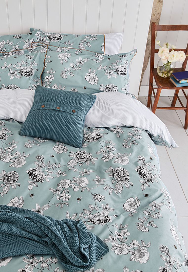 Make diving into bed even more of a treat with this floral duvet set. Featuring an all over hand-drawn print (complete with appearances from some colourful bees) against a plain blue background, it will add a classic look to any bedroom. Flip it over and you'll find a horizontal stripe design that complements the set perfectly. Each set comes complete with two matching Oxford pillowcases (single sets come with one) and has a thread count of 180 for much-needed cosiness. BCI Cotton, Made in Pakistan.
