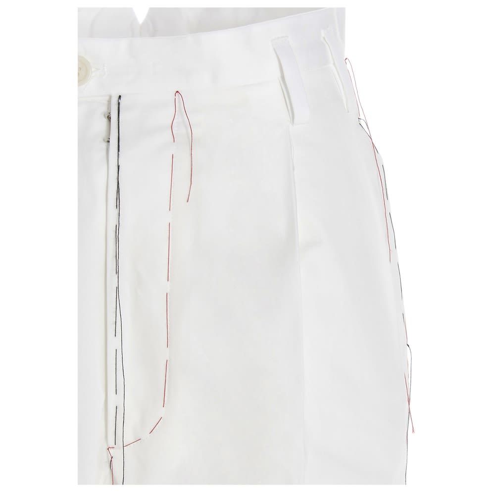 Maison Margiela cotton trousers with regular waist, wide leg and contrasting stitching.
