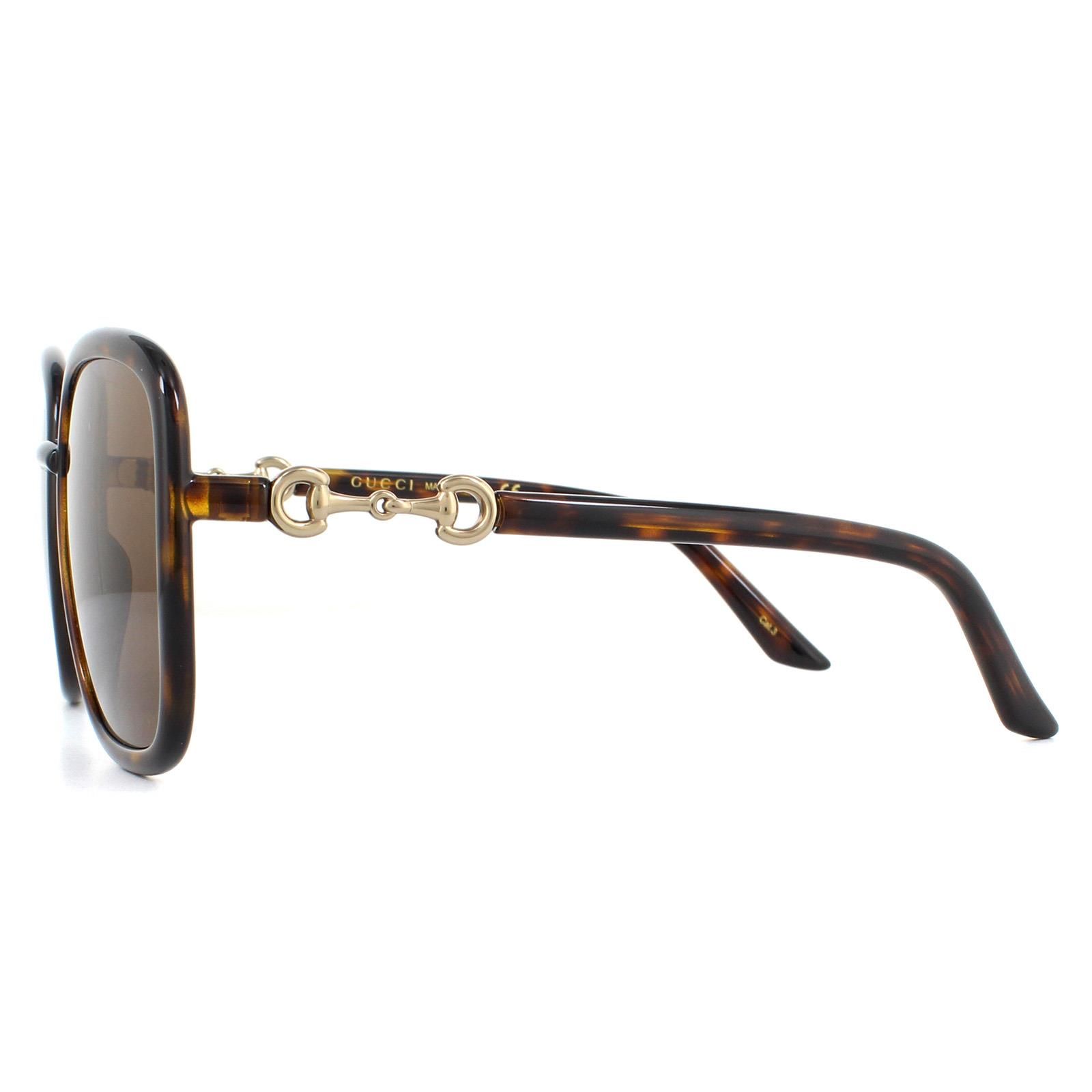 Gucci Sunglasses GG0893S 002 Dark Havana Brown are a simple square style for women crafted from lightweight acetate. The sophisticated design is ultra feminine and flattering for most faces. Finished with Gucci's iconic horsebit design on the hinges and signed off with the Gucci text logo on the inside of the right temple.