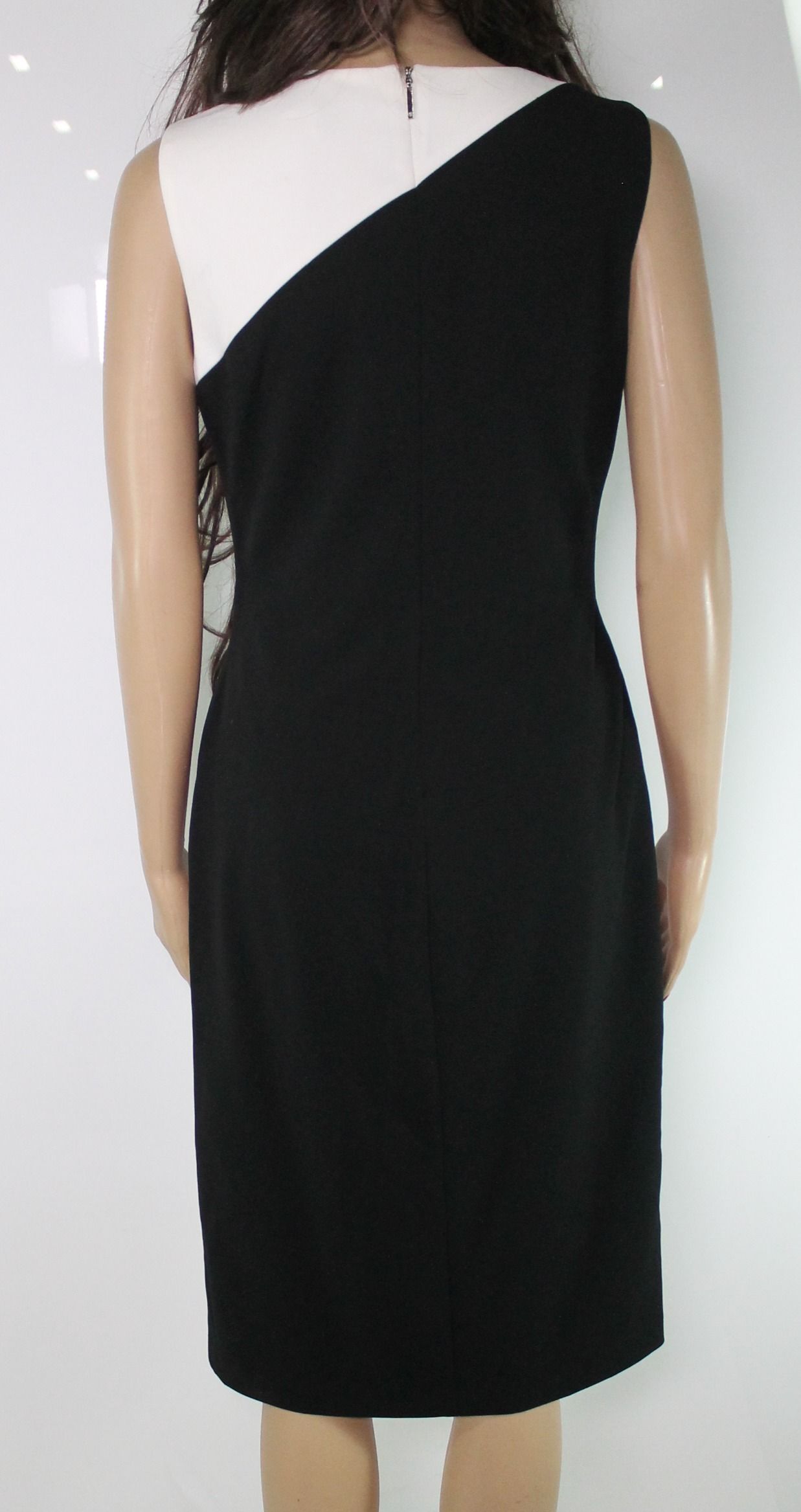 <br>Color: Blacks<br>Size Type: Regular<br>Size (Women's): 4<br>Lined: Yes<br>Sleeve Style: Sleeveless<br>Occasion: Any Occasion<br>Style: Sheath Dress<br>Look: Wedding Guest<br>Dress Length: Knee Length<br>Material: Polyester<br>Zipper: Back Zipper