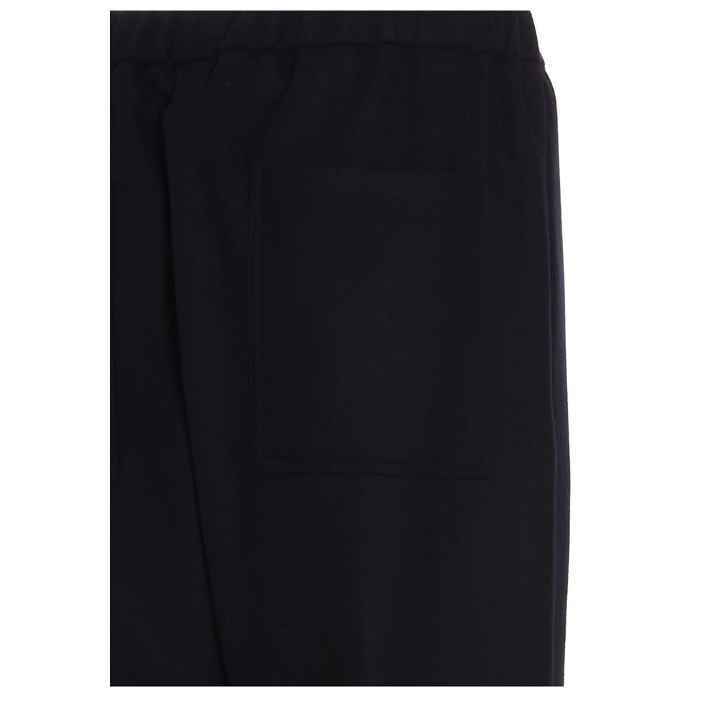 'Jil Sander+' flannel trousers with an elastic waistband, a button closure, and a relaxed fit.