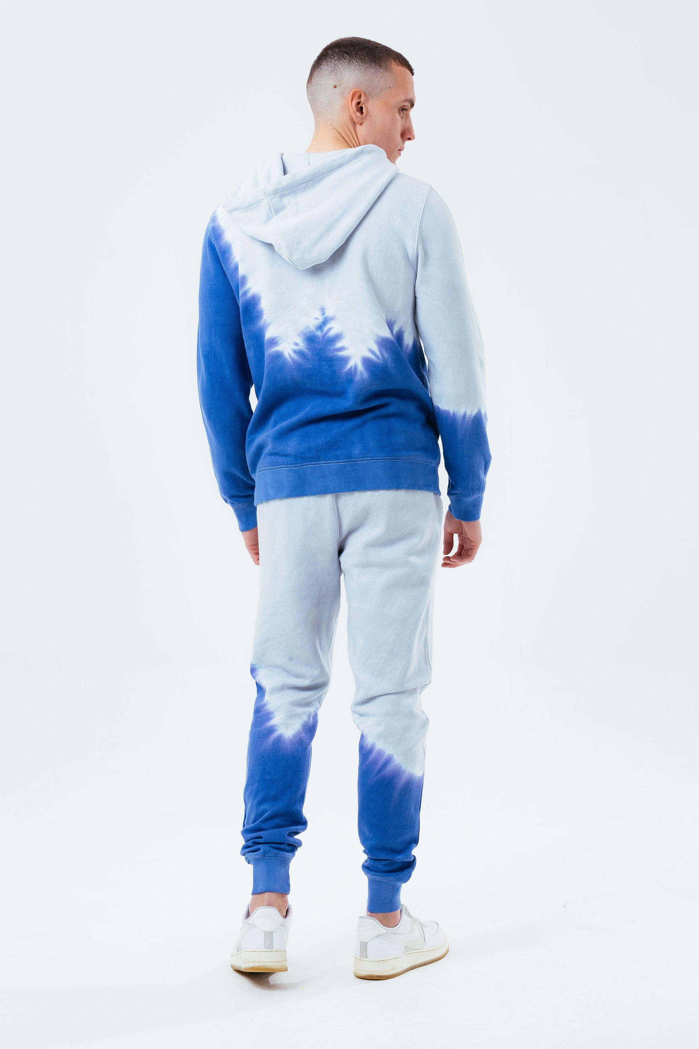 Stay on trend with the Hype Grey Navy Tie Dye Scribble Logo Men's Pullover Hoodie and grab the matching joggers to complete the set. Designed in a 70% Cotton 30% Polyester soft-touch fabric with the supreme amount of comfort you need from your new pullover. Finished with fitted hem and cuffs, kangaroo pocket and hood. Machine wash at 30 degrees.