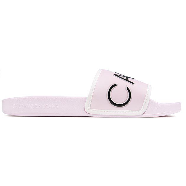 Women's Light Pink Calvin Klein Jeans Slip-on Sandals Designed With A White Edged Wide Toe Strap With Oversized Ck Branding In Black And A Comfy Pu Upper. These Ladies' Pool Style Sliders Have A Contoured Footbed And Flat Rubber Sole With Embossed Calvin Klein Branding.