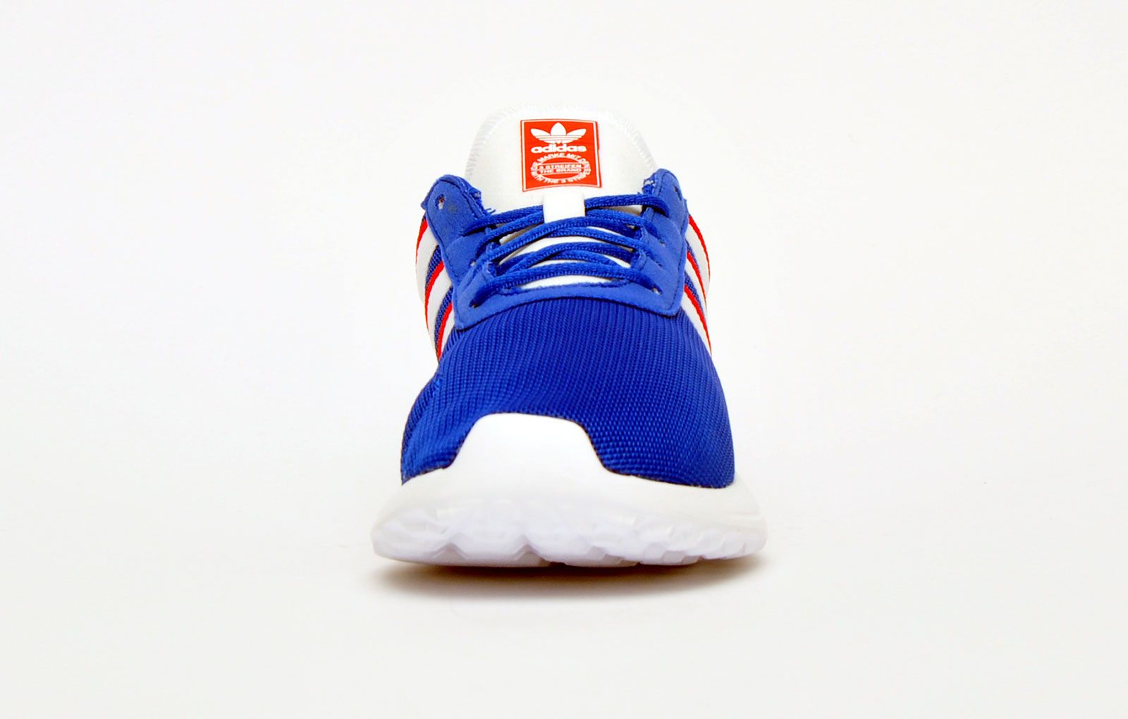 Childrens adidas Originals LA Lite Trainers in royal white.- Mesh upper.- Elastic and regular laces. - Lightweight and breathable. - OrthoLite® sockliner and Adifit length-measuring insole.- One-piece EVA midsole and outsole.- Textile and Synthetic upper  Textile lining  Synthetic sole.- Ref.: FW0585C
