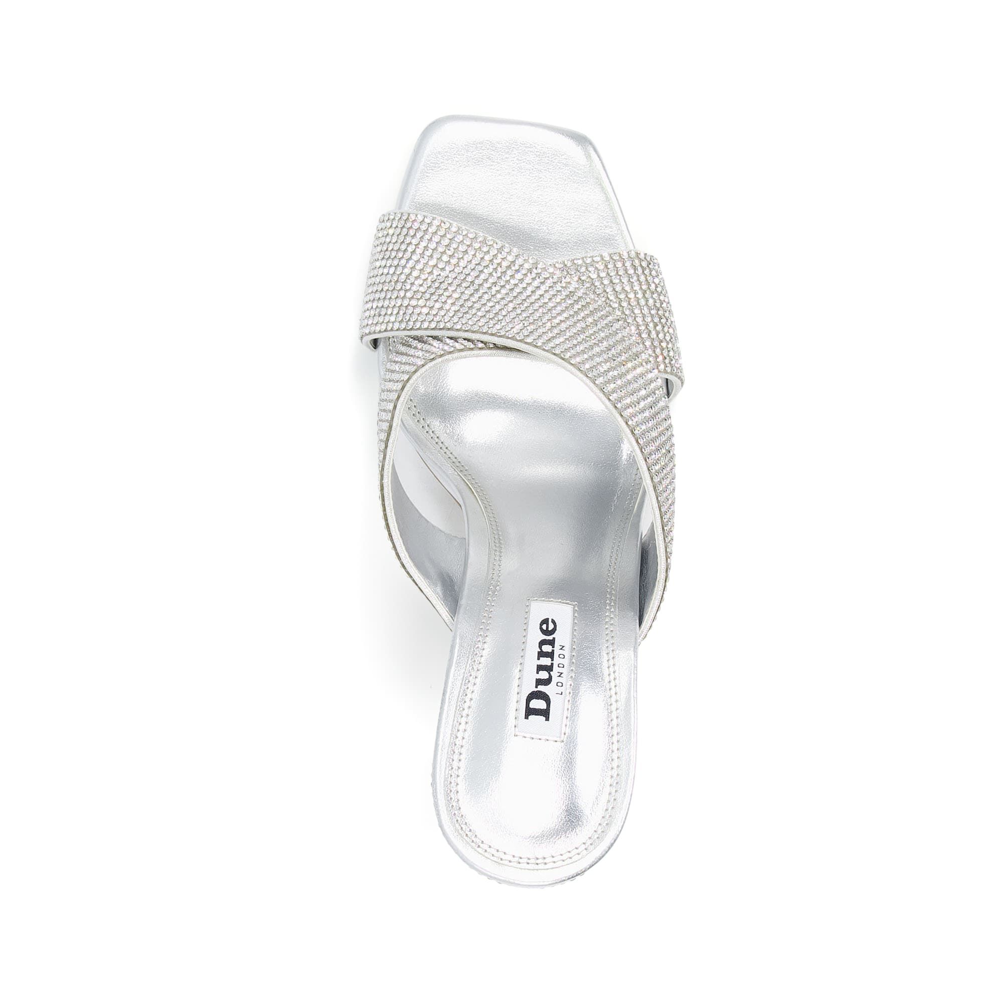 You know our mantra. If you're planning a look, start with the shoes. This heavily embellished style features a sparkly crystal design with a chic mule silhouette.  Whatever the occasion, these will elevate your look.