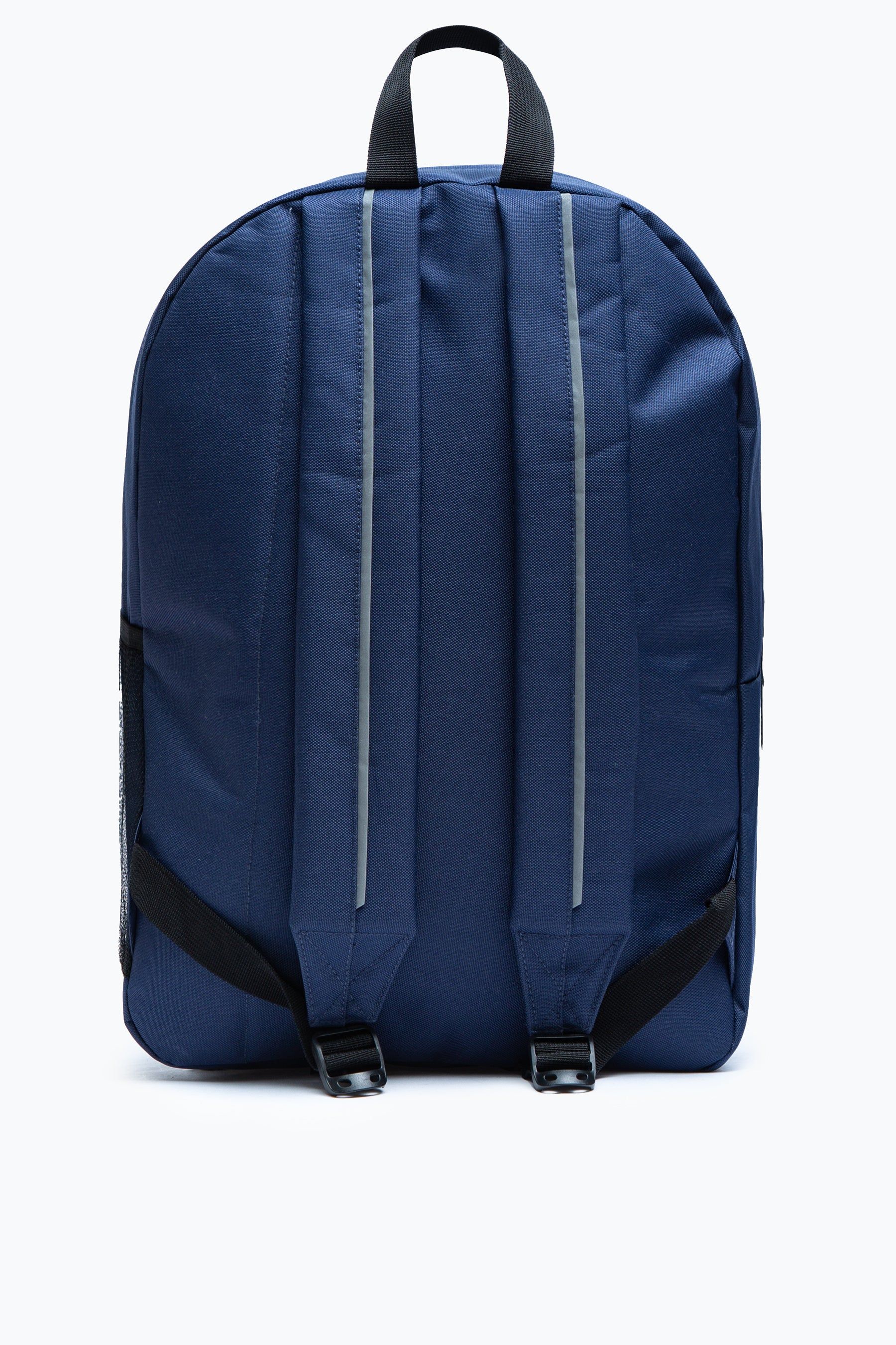 The HYPE. Navy Utility Backpack. Designed in our unisex utility shape, creating a backpack for everyone. Featuring an enlarged front pocket to keep all your essentials, such as snacks, phone charger, lip balms, flip flops. This backpack highlights an elasticated mesh pocket on the side to store your favourite water bottle. The design features an all-over classic black colour palette. Wipe clean only.
