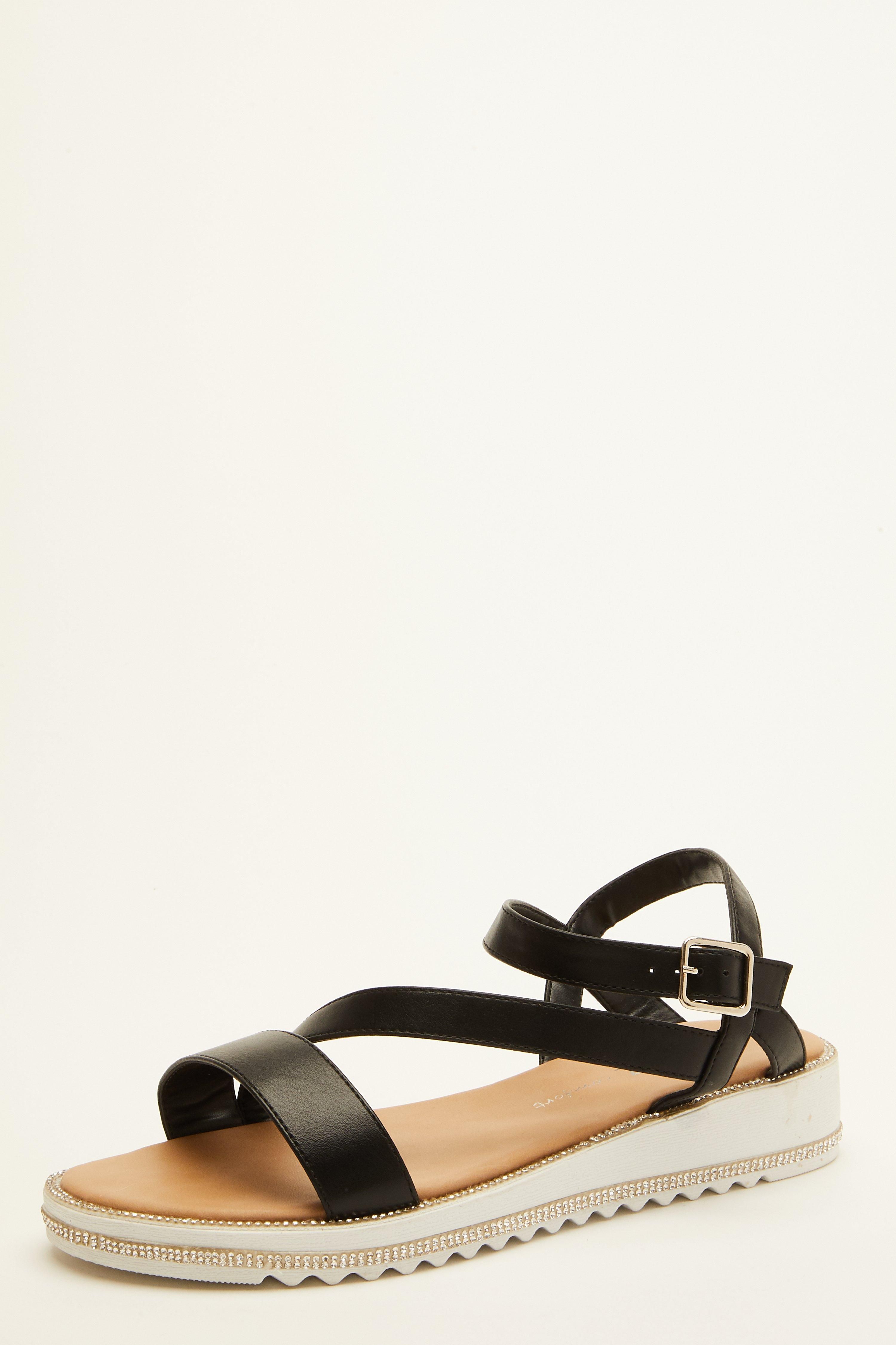 - Platform wedge  - Faux leather   - Asymmetric straps   - Embellished sole   - Heel height: 1.5