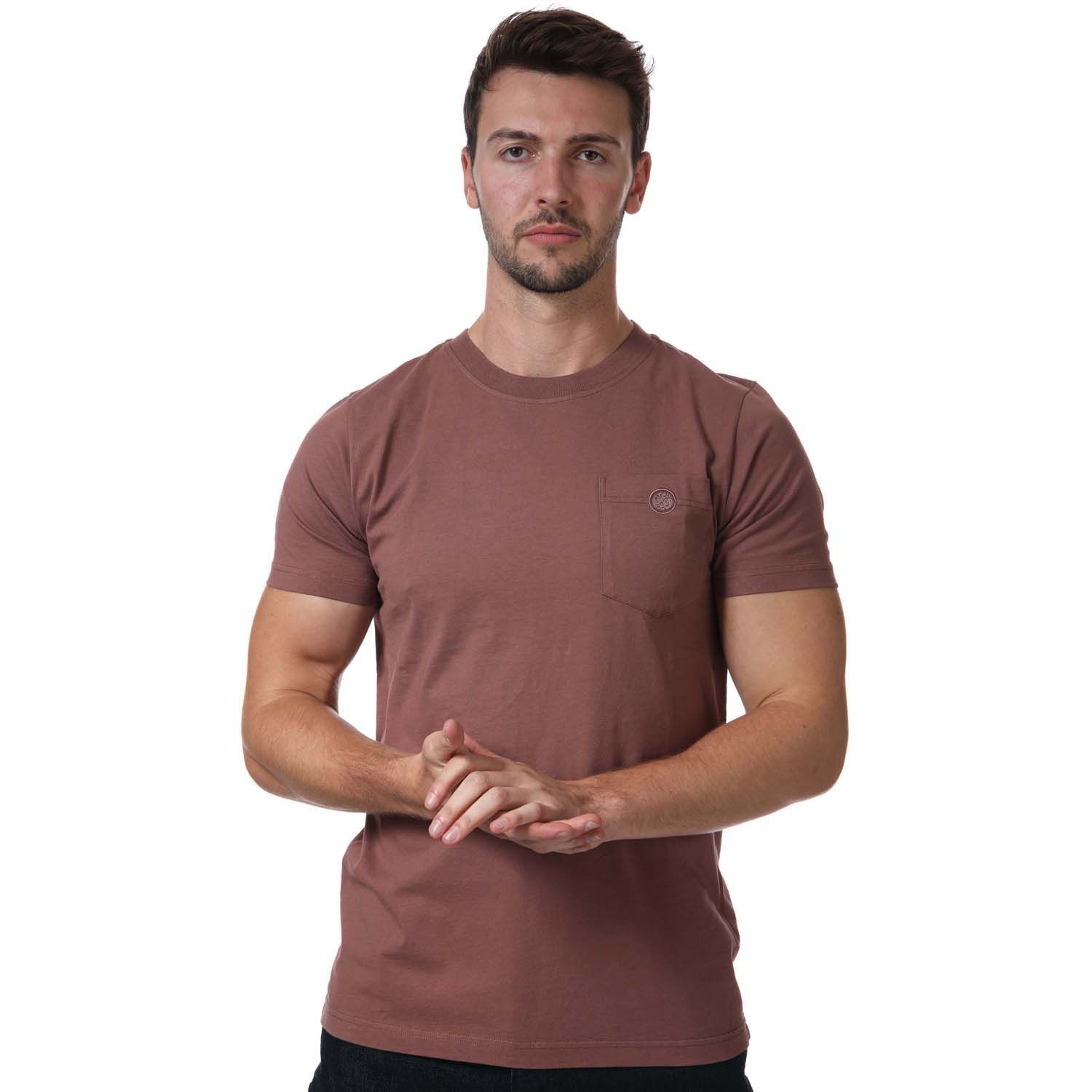 Pretty Green Vega Pocket T- Shirt in burgundy.- Ribbed crew neckline.- Short sleeves.- Pouch pocket is situated on the left of the chest.- Signature Pretty Green logo badge embroidered on top of the pocket.- Regular fit.- 100% Organic Cotton.- Ref:G21Q3MUJER902B